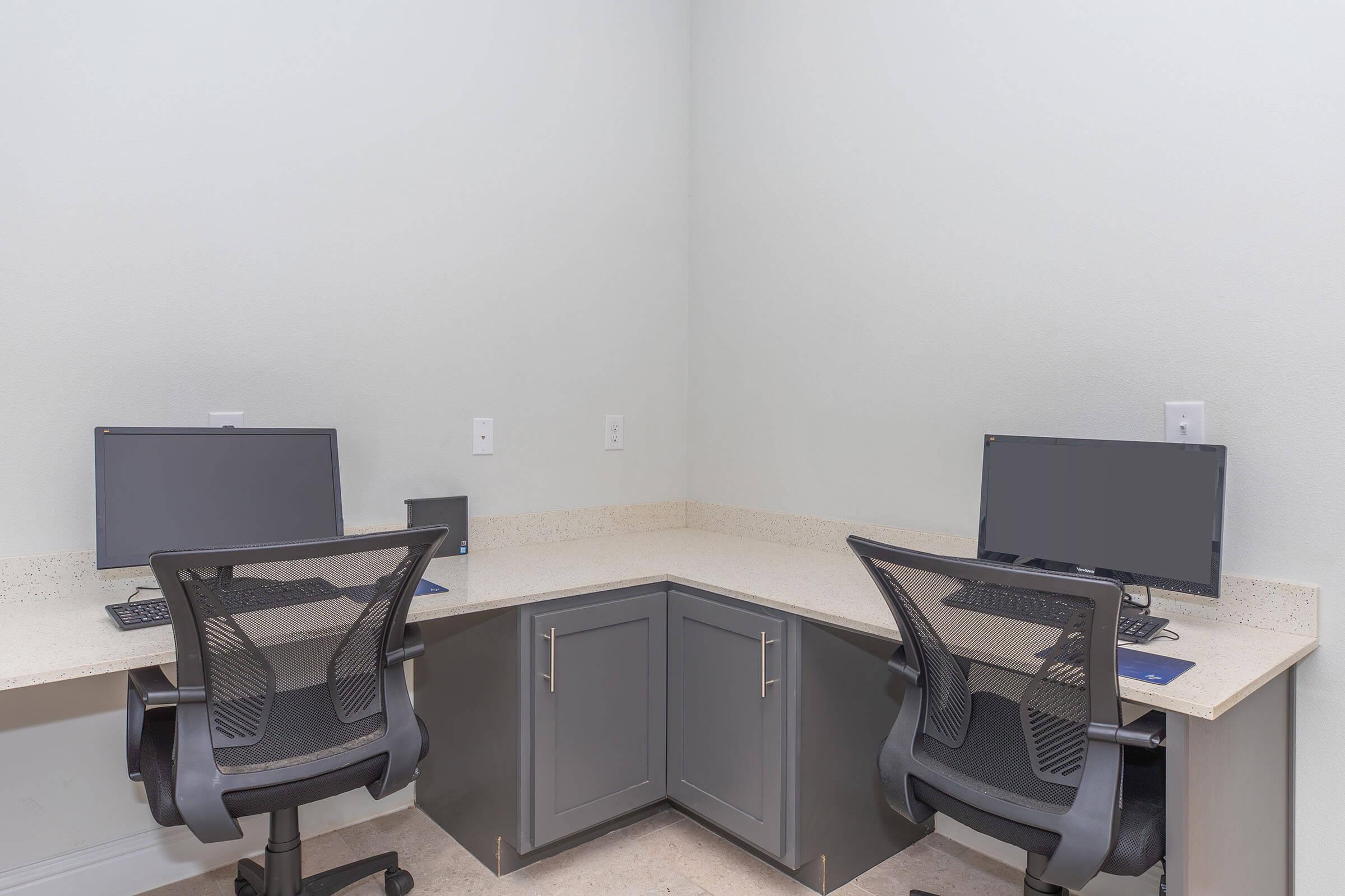 a desk with a chair in a room