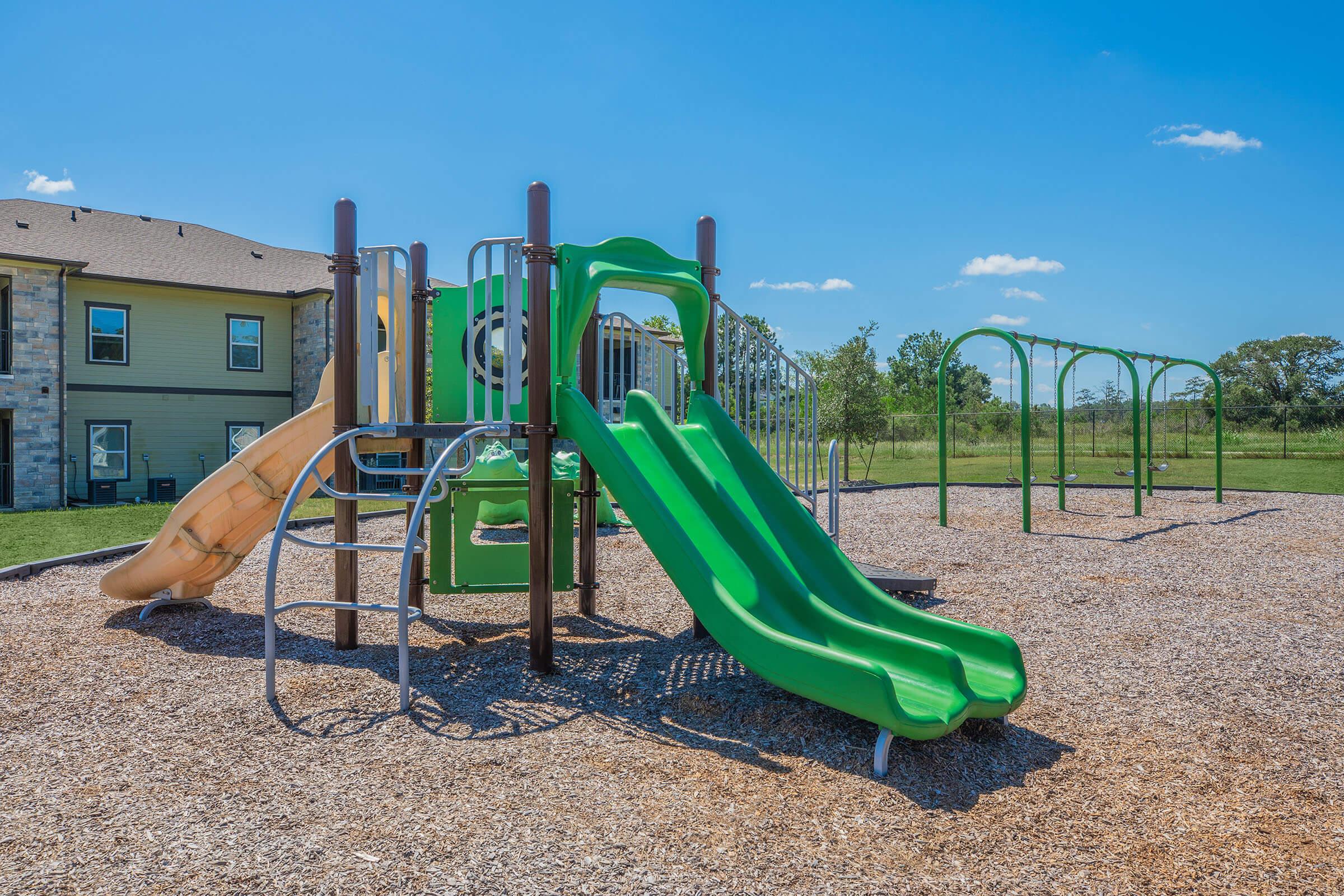 a green lawn chair on a playground