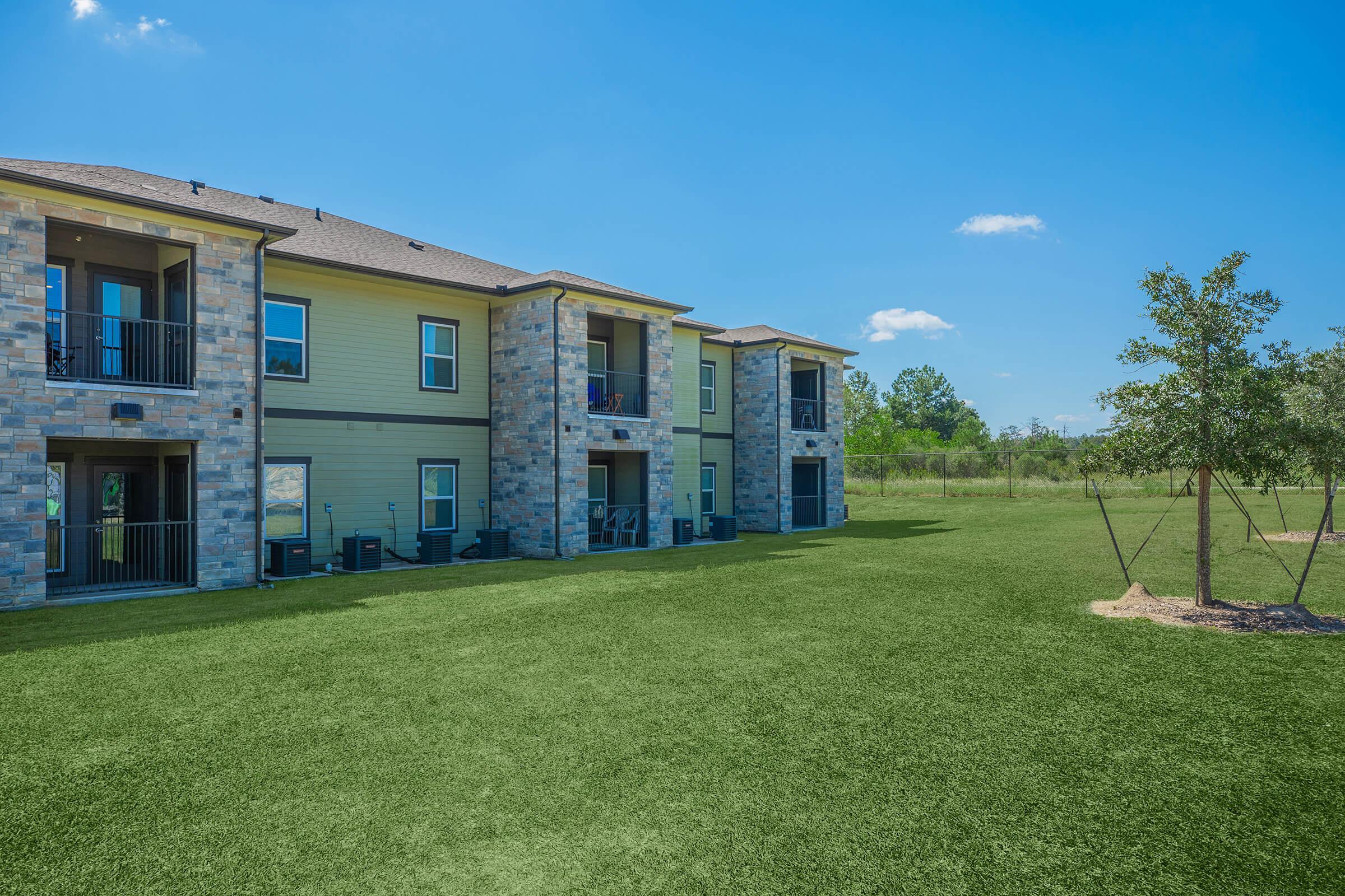 a large lawn in front of a house