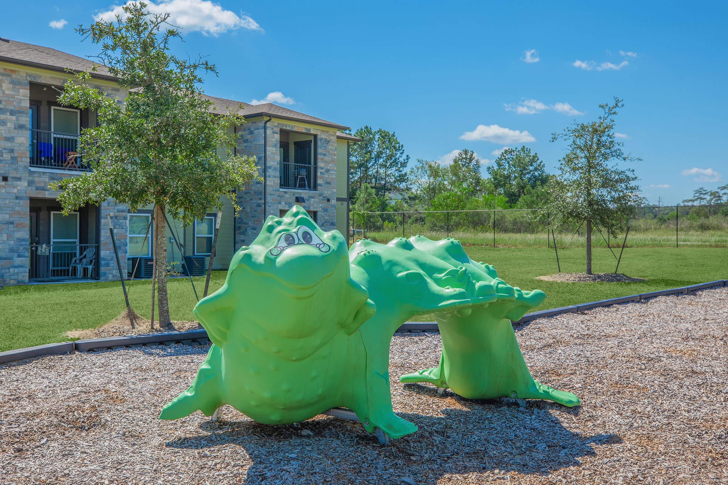 a green lawn in front of a building