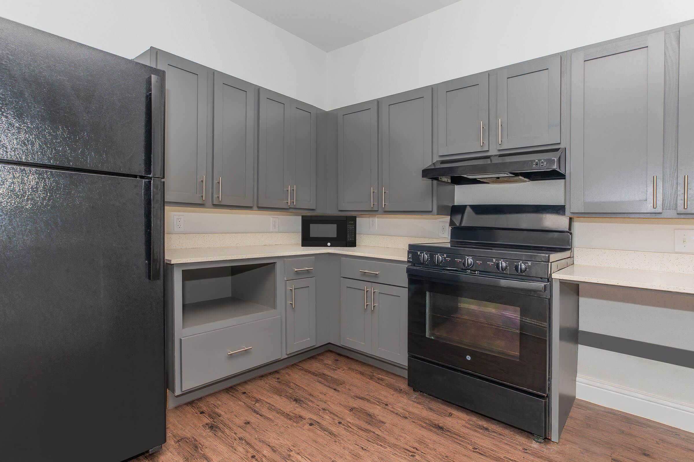 a kitchen with a stove and a refrigerator