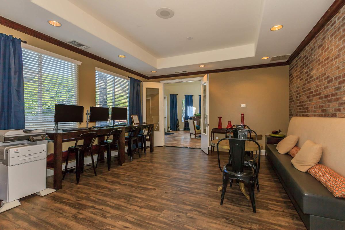 a living room filled with furniture and a large window