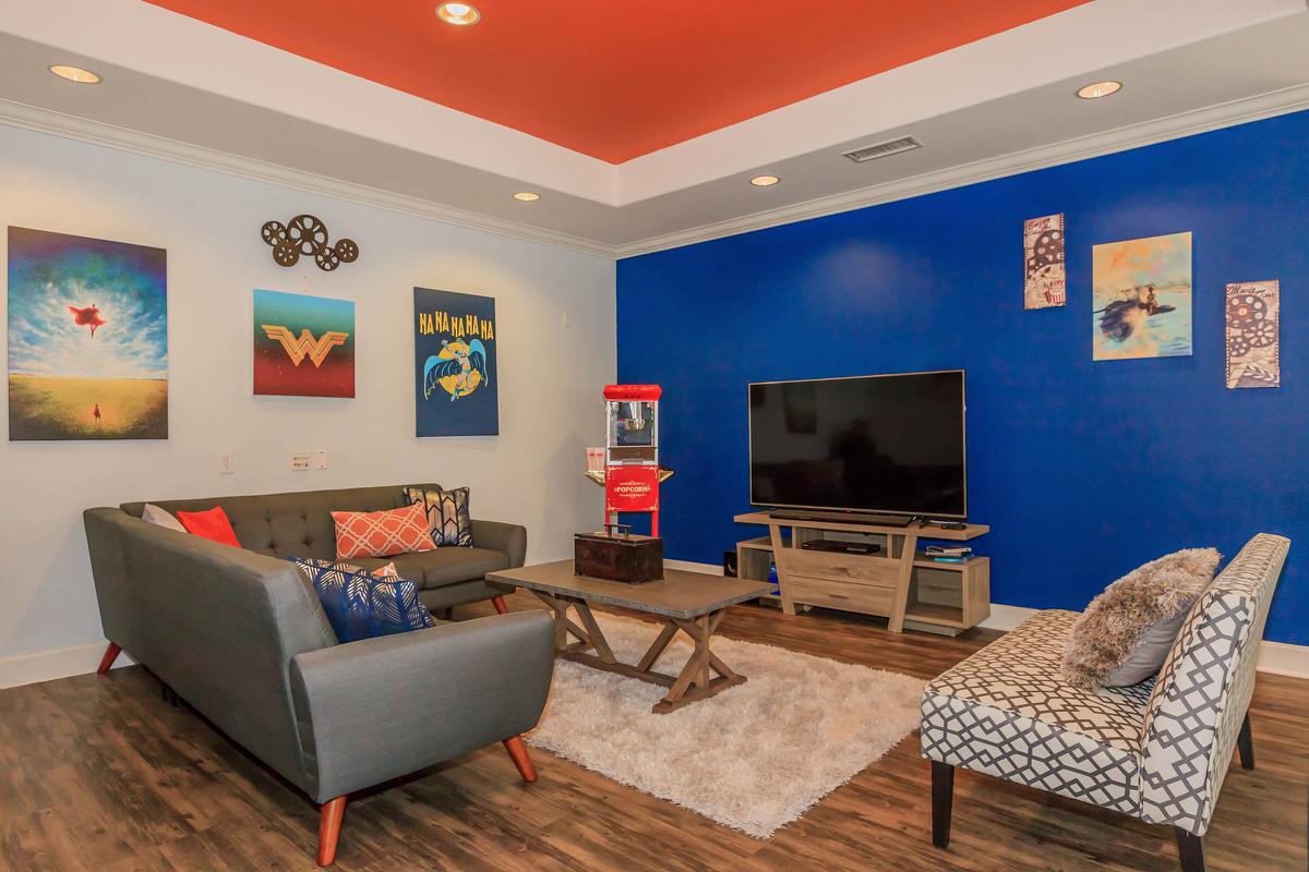 a living room filled with furniture and a fireplace