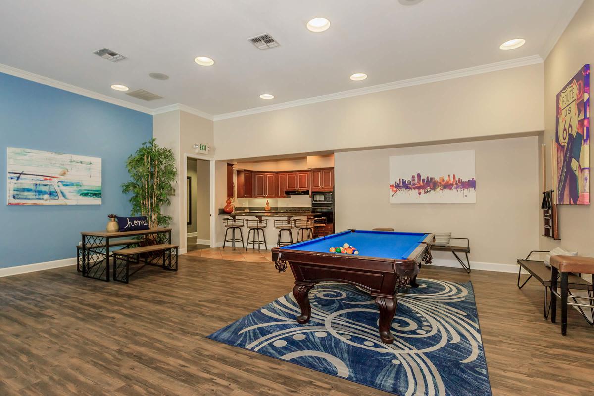 a living room filled with furniture and a table