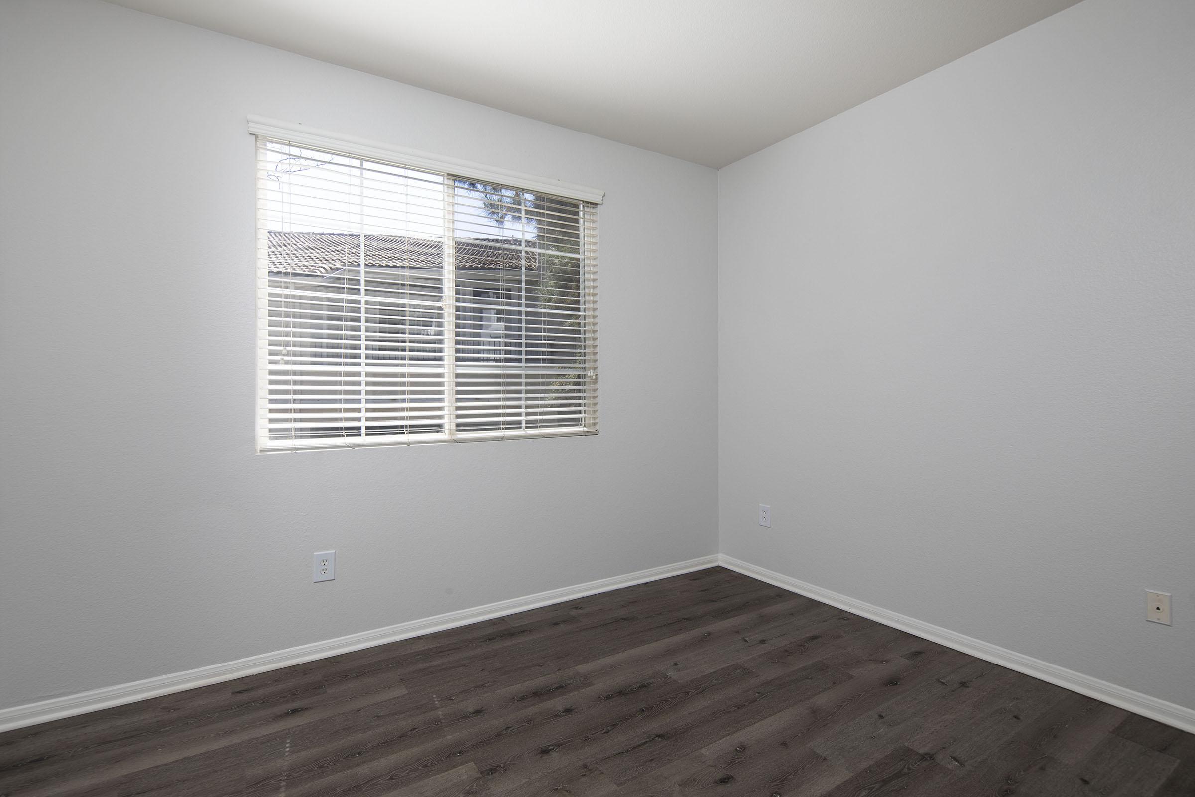 a bedroom with a large window