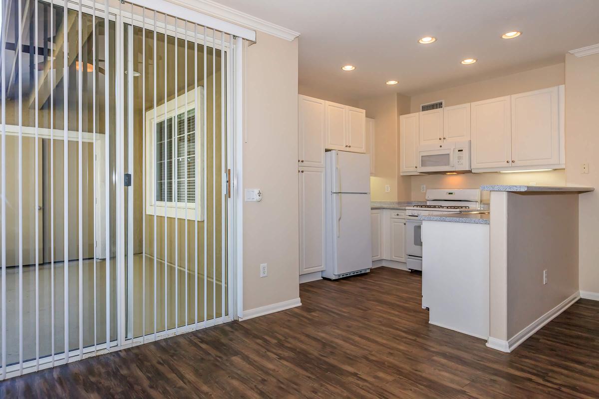 a large white refrigerator in a kitchen