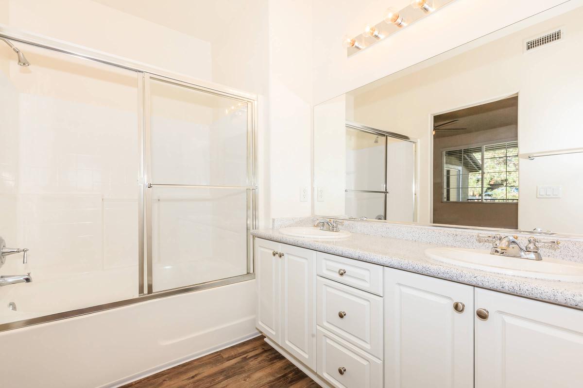 a kitchen with white cabinets