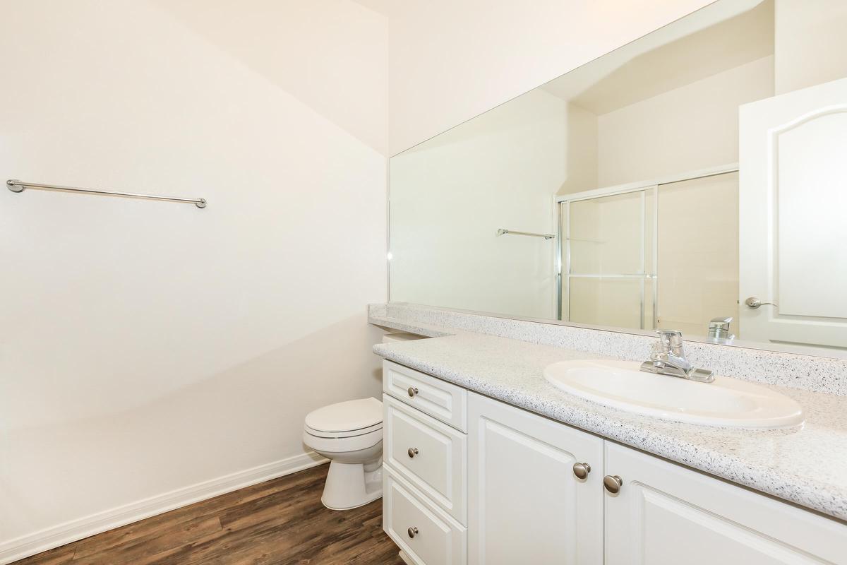 a kitchen with a sink and a mirror