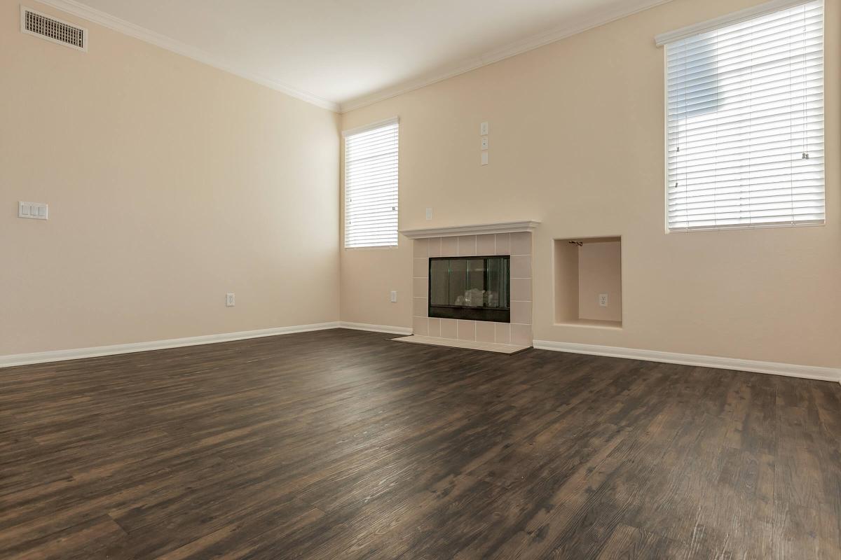 a large empty room with a wooden floor