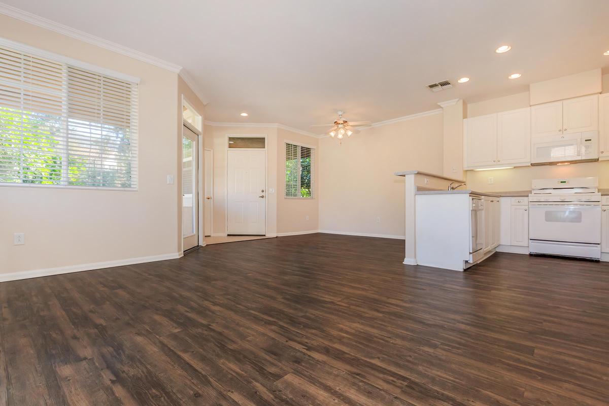 a kitchen with a wood floor