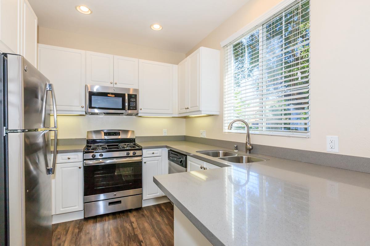 a large kitchen with stainless steel appliances