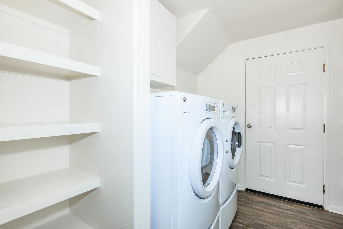 a white refrigerator freezer sitting in a room