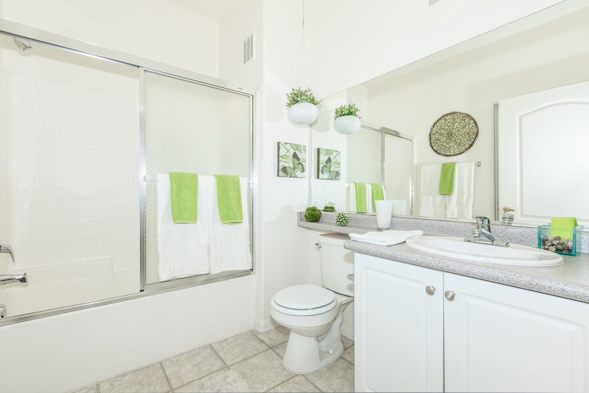 a kitchen with a sink and a mirror