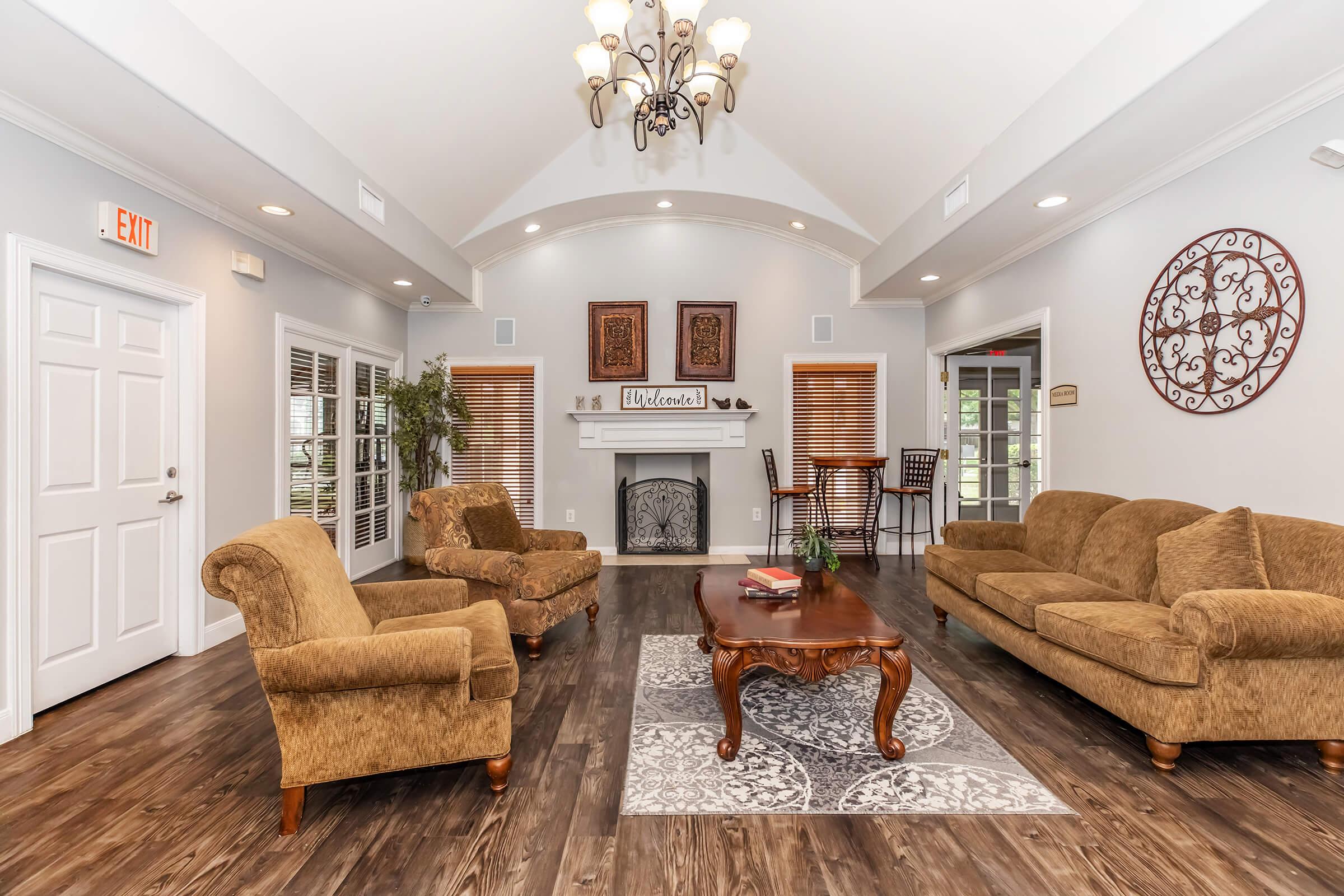 a living room filled with furniture and a fireplace