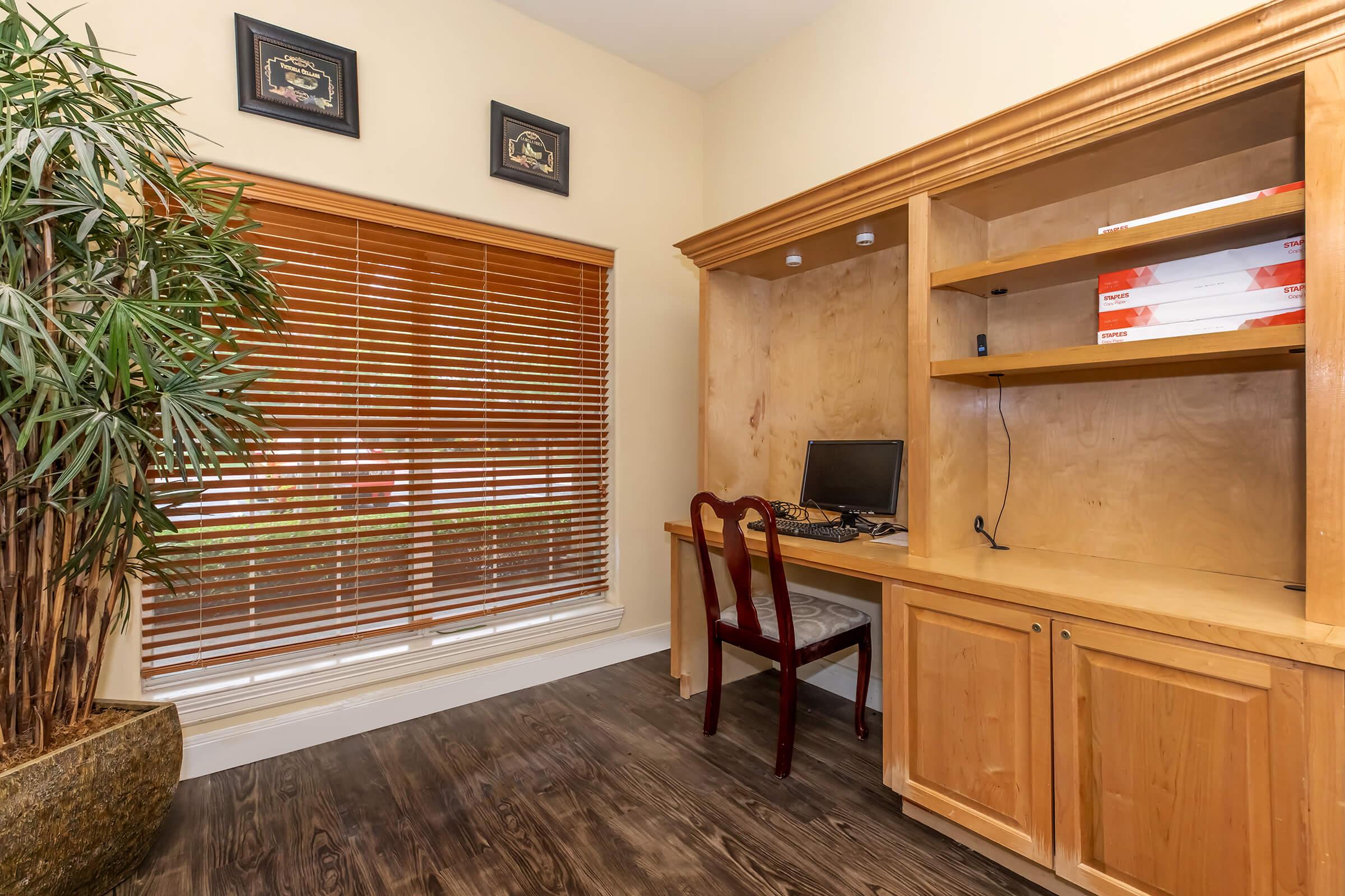 a kitchen with wooden cabinets