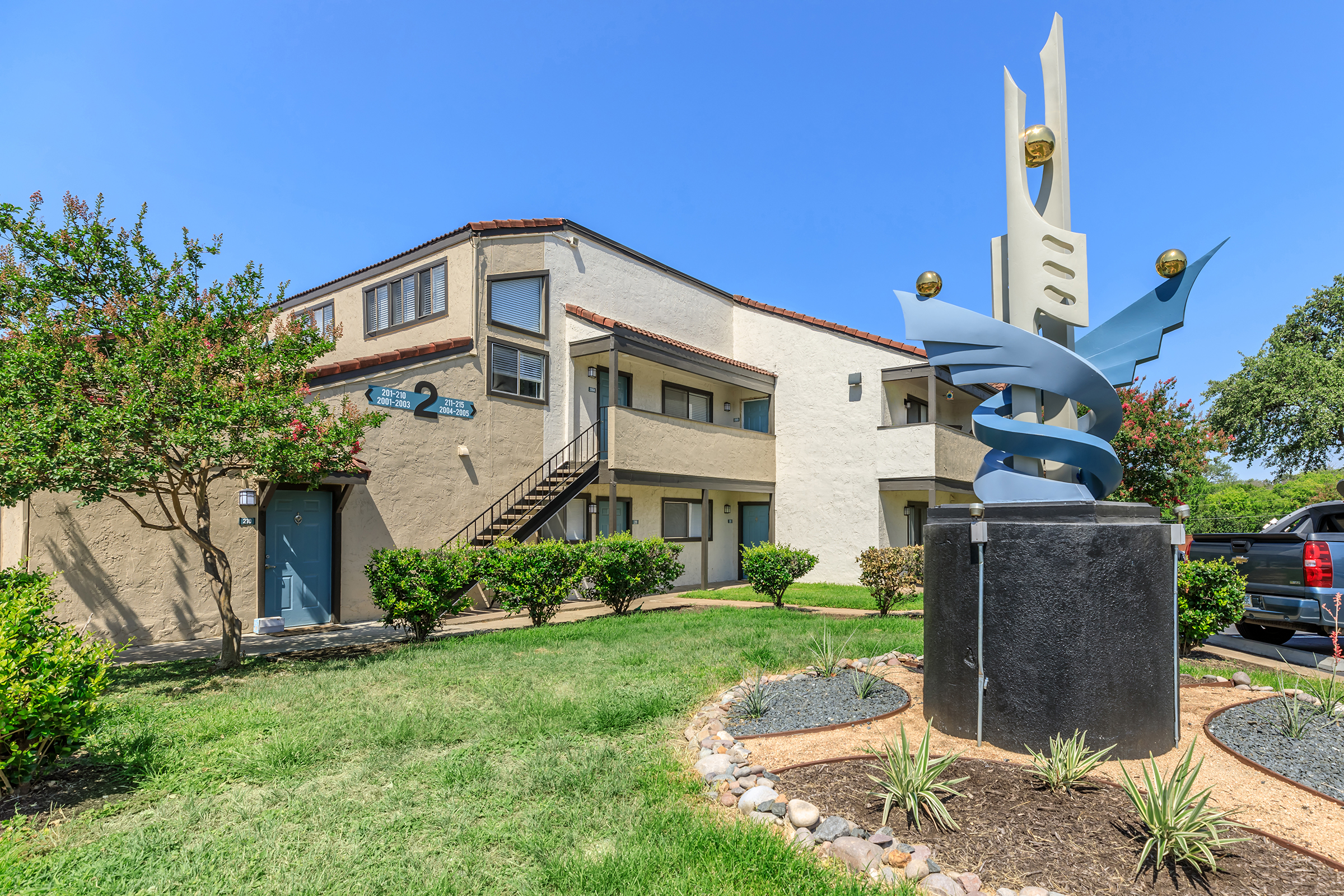 a statue in front of a house