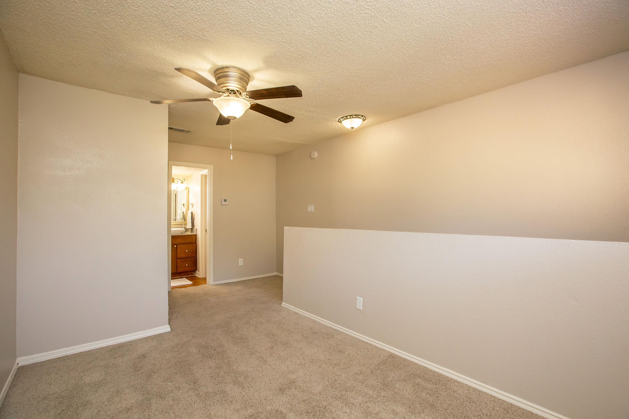 a bedroom with a large mirror