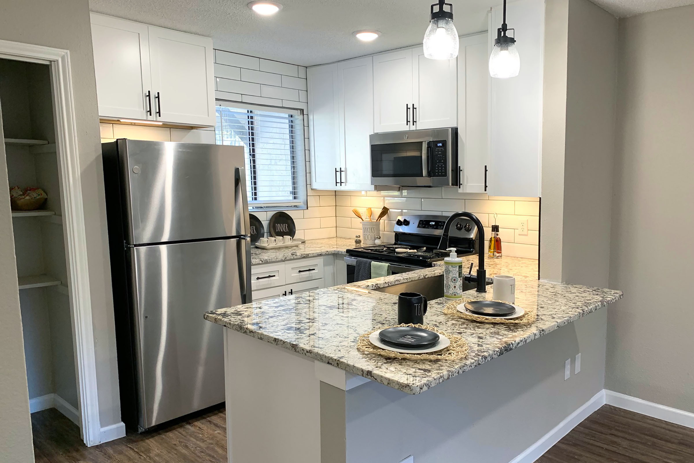 a modern kitchen with stainless steel appliances