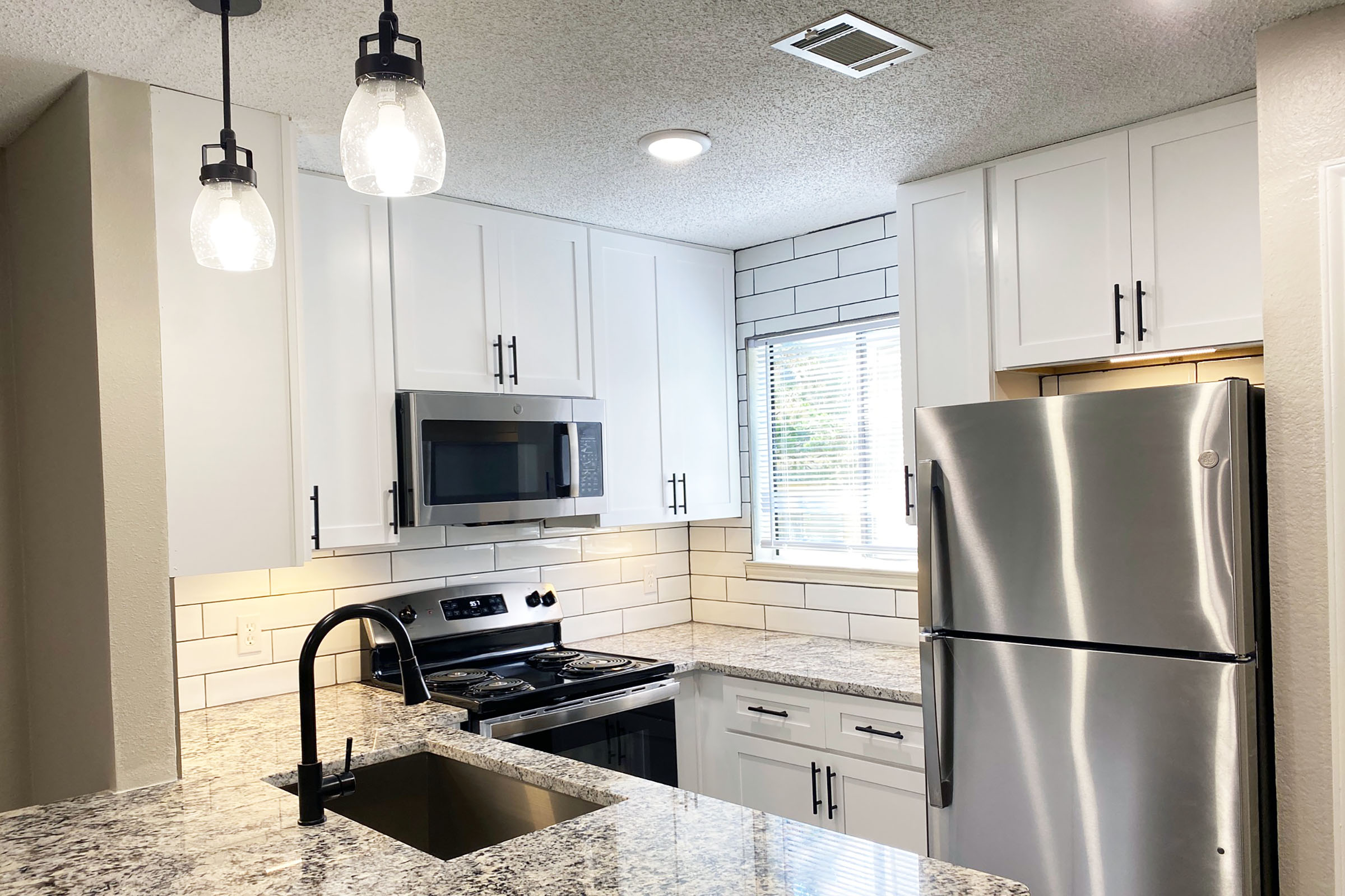 a stainless steel refrigerator in a kitchen