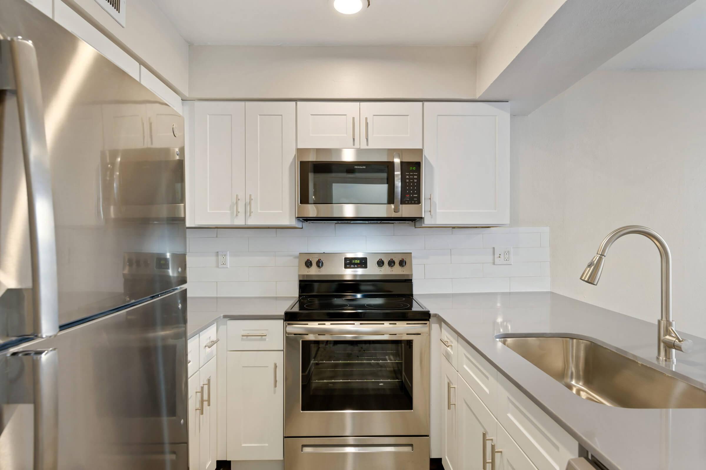 a kitchen with stainless steel appliances