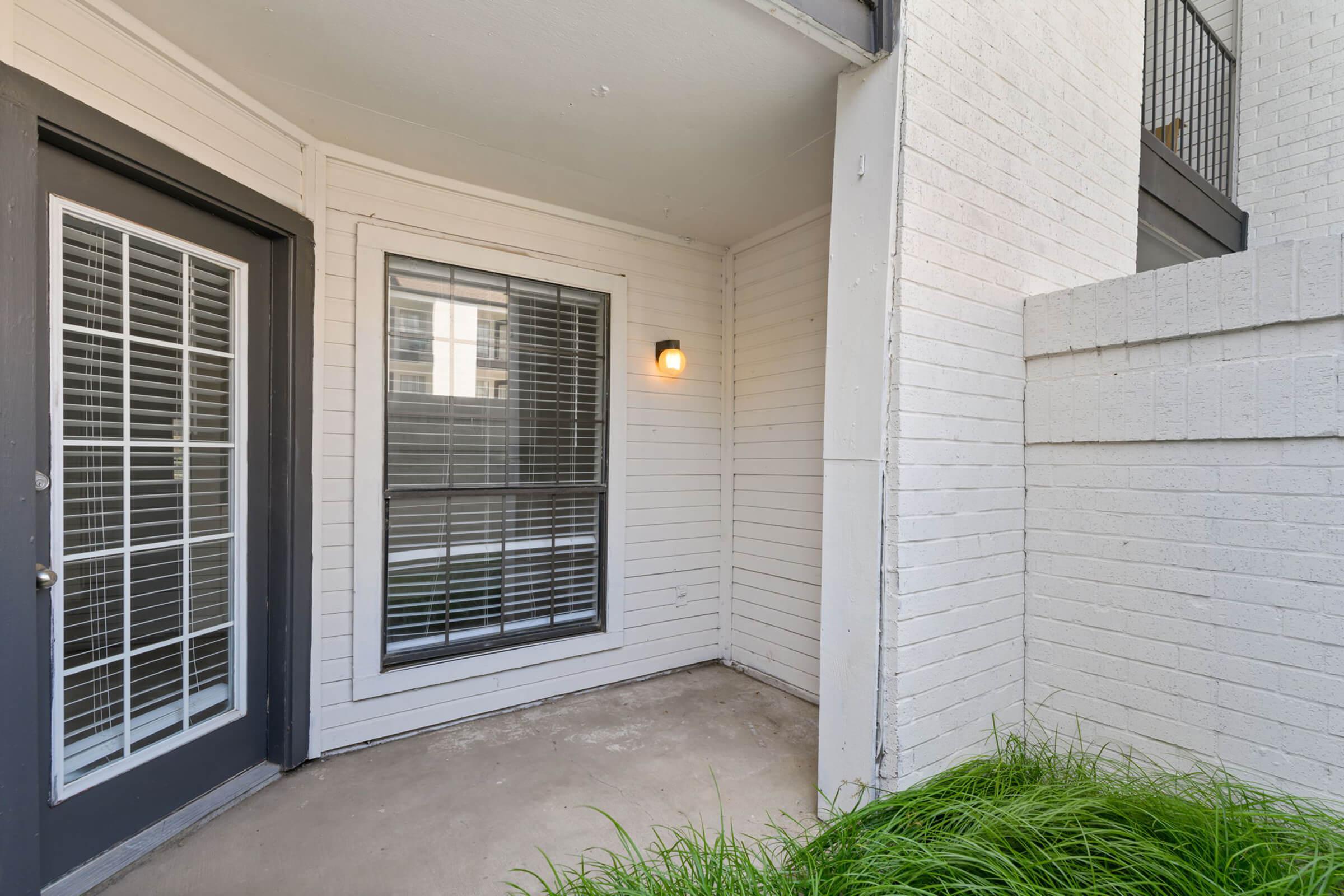 a door with a window in a brick building
