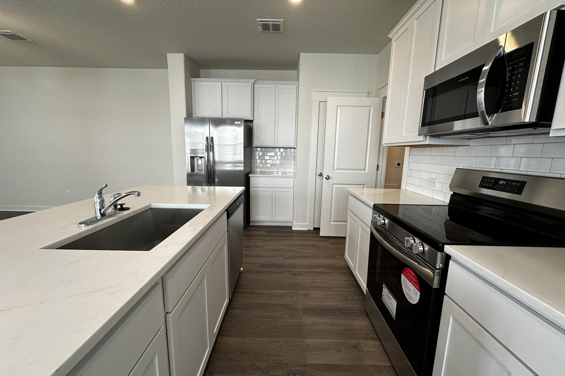 a kitchen with a sink and a window