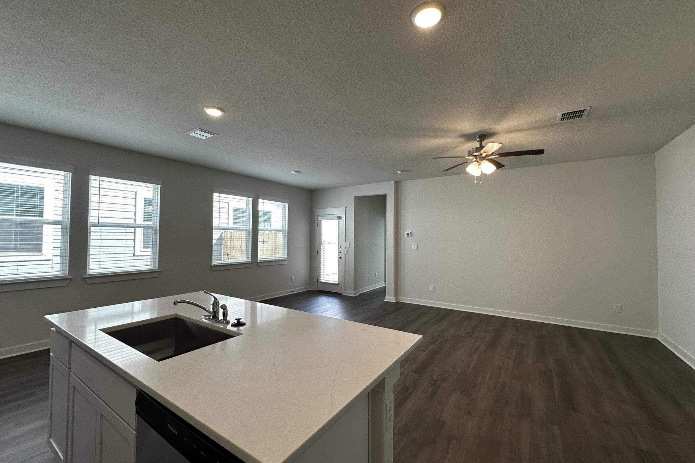 a kitchen with an island in the middle of a room