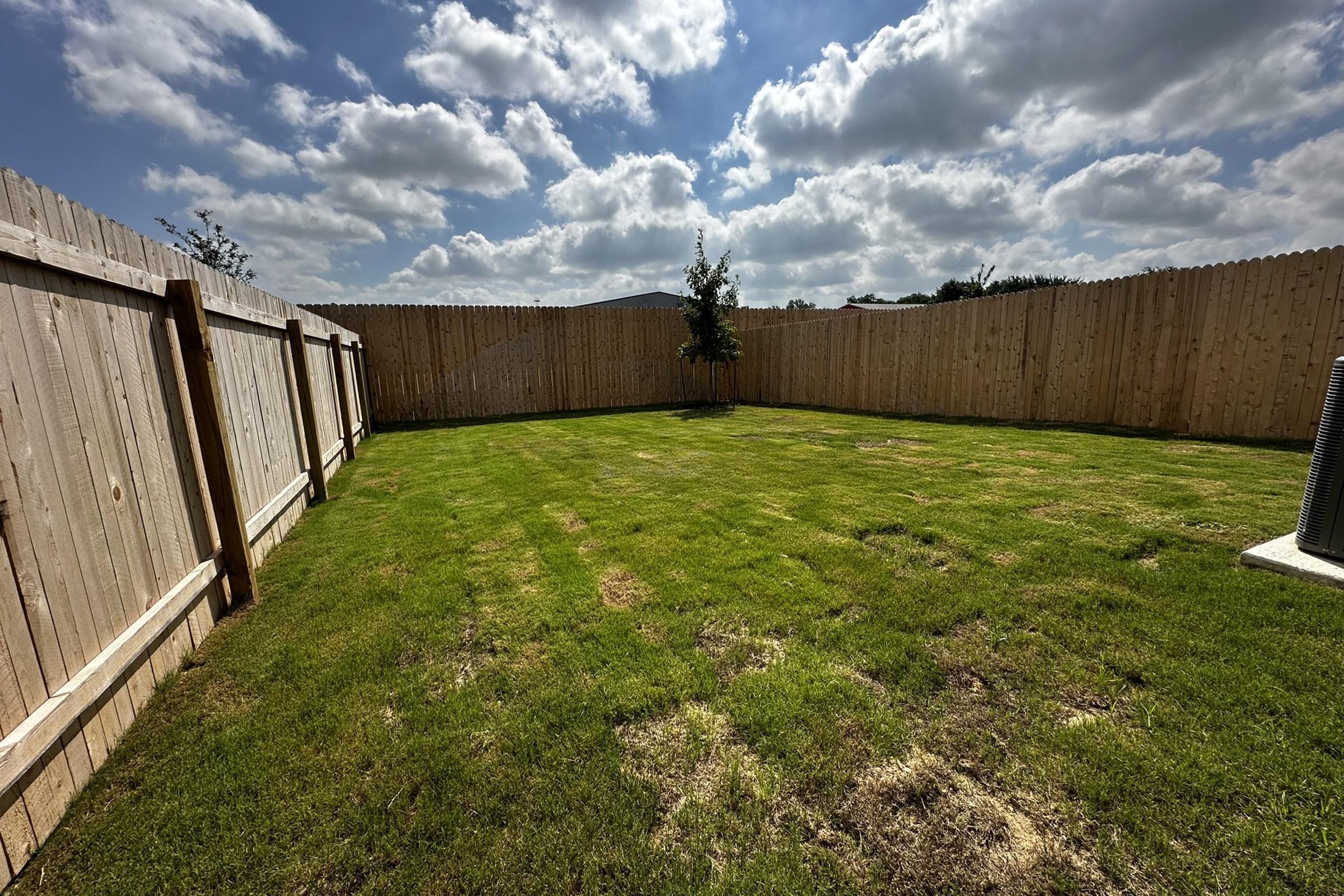 a building with a grassy field