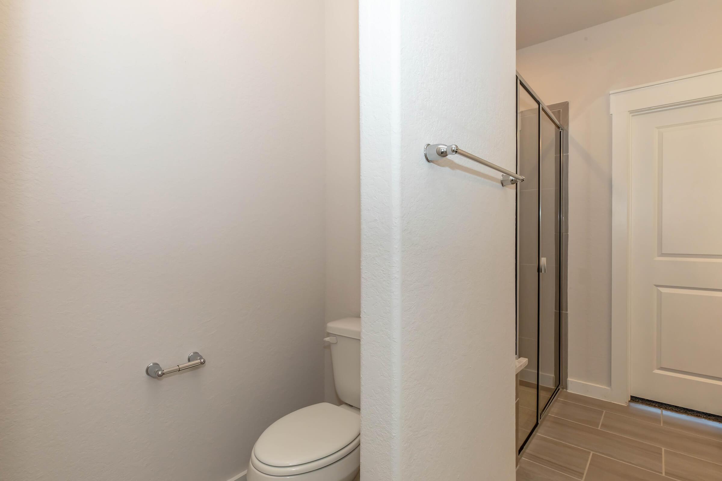 a room with a sink and a shower