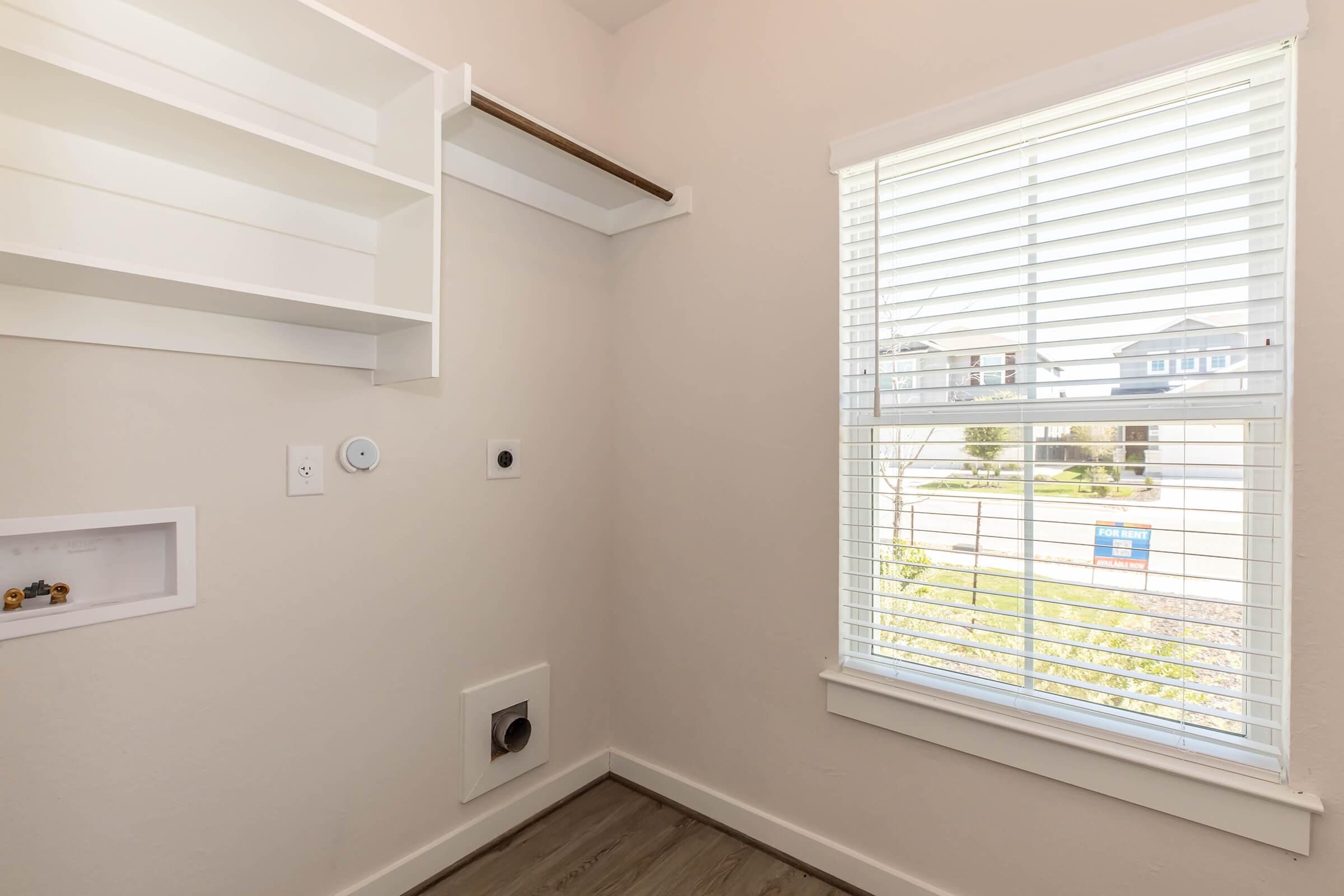 a room with a sink and a window