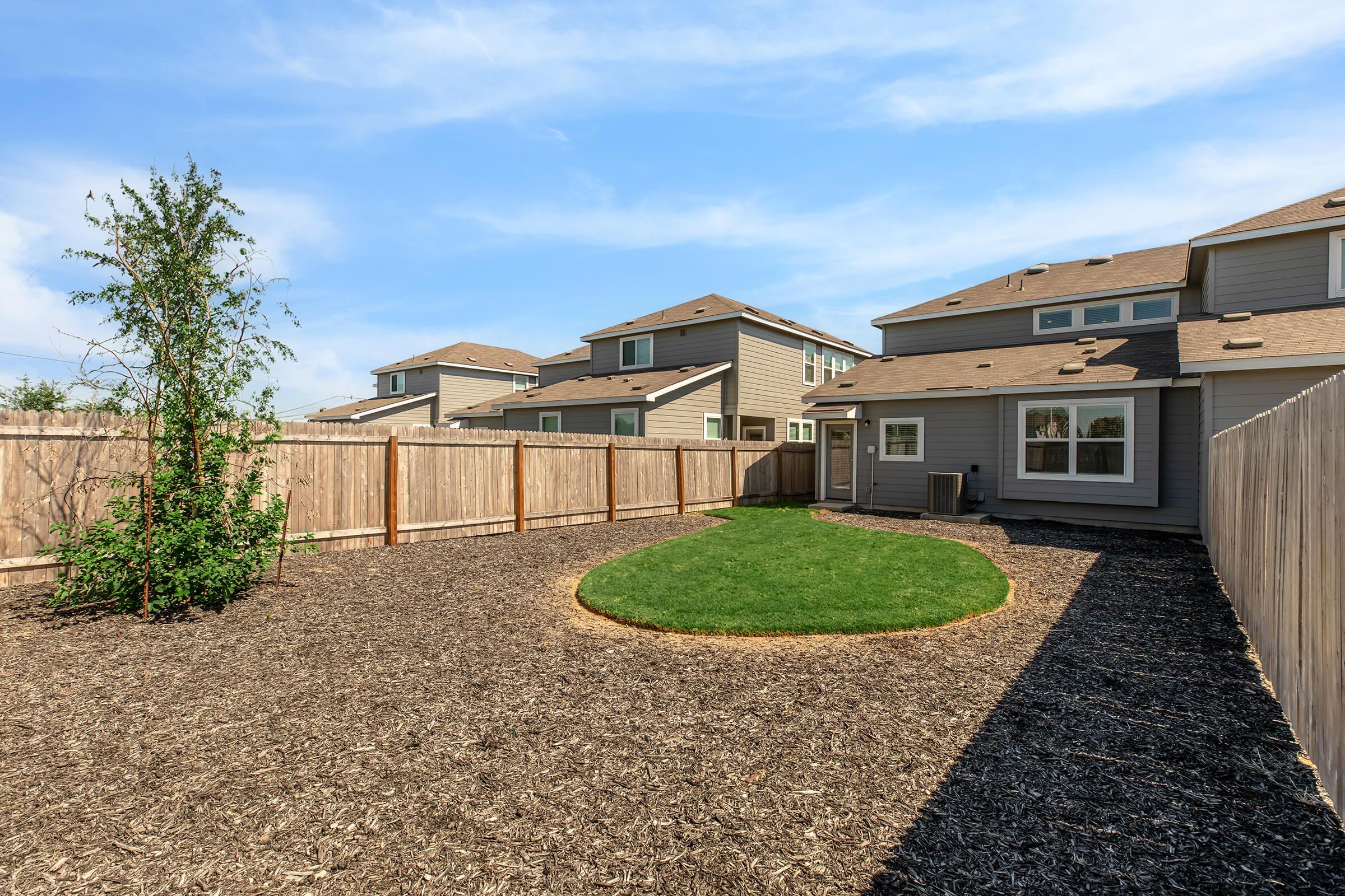 a house with trees in the background