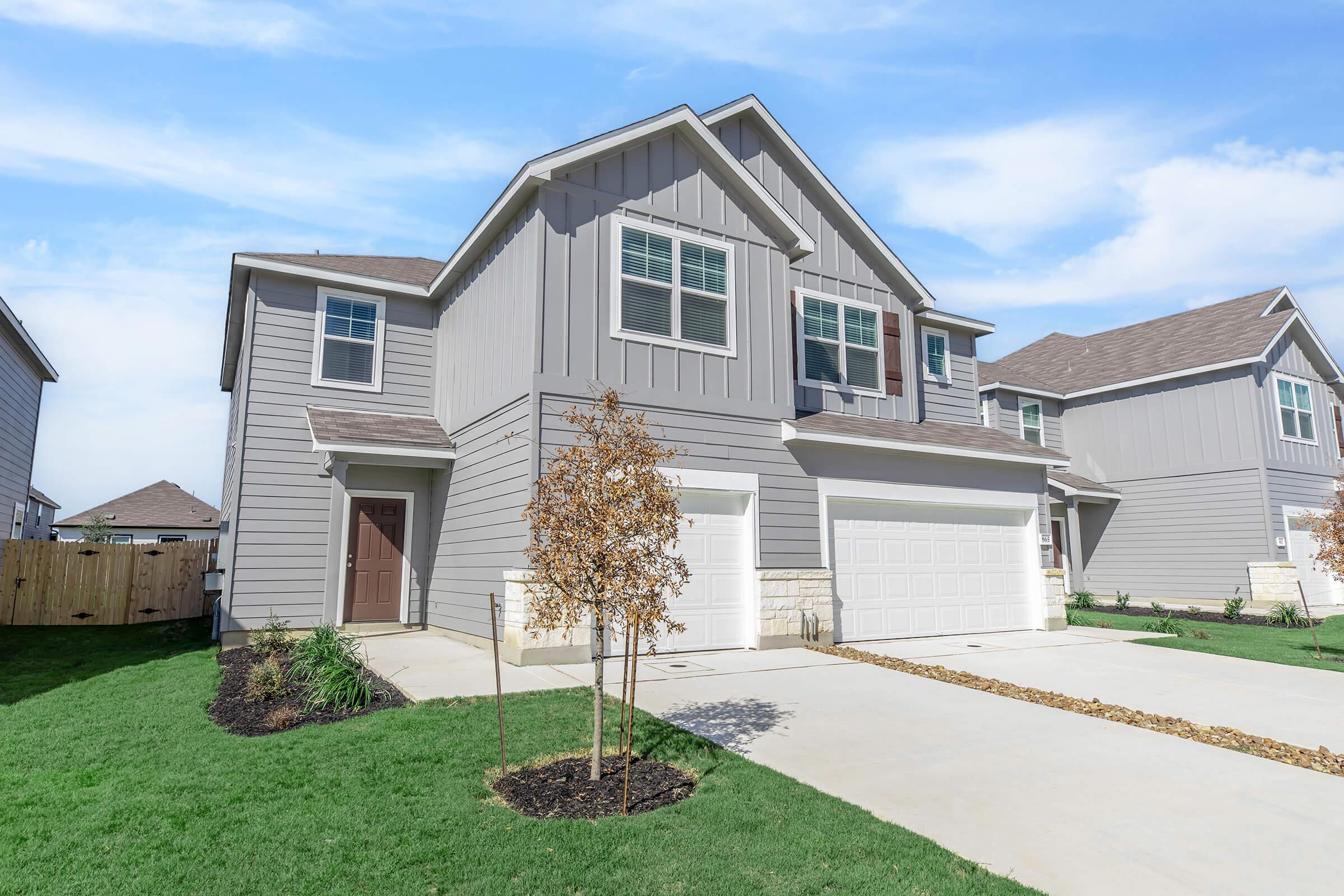 a large lawn in front of a house