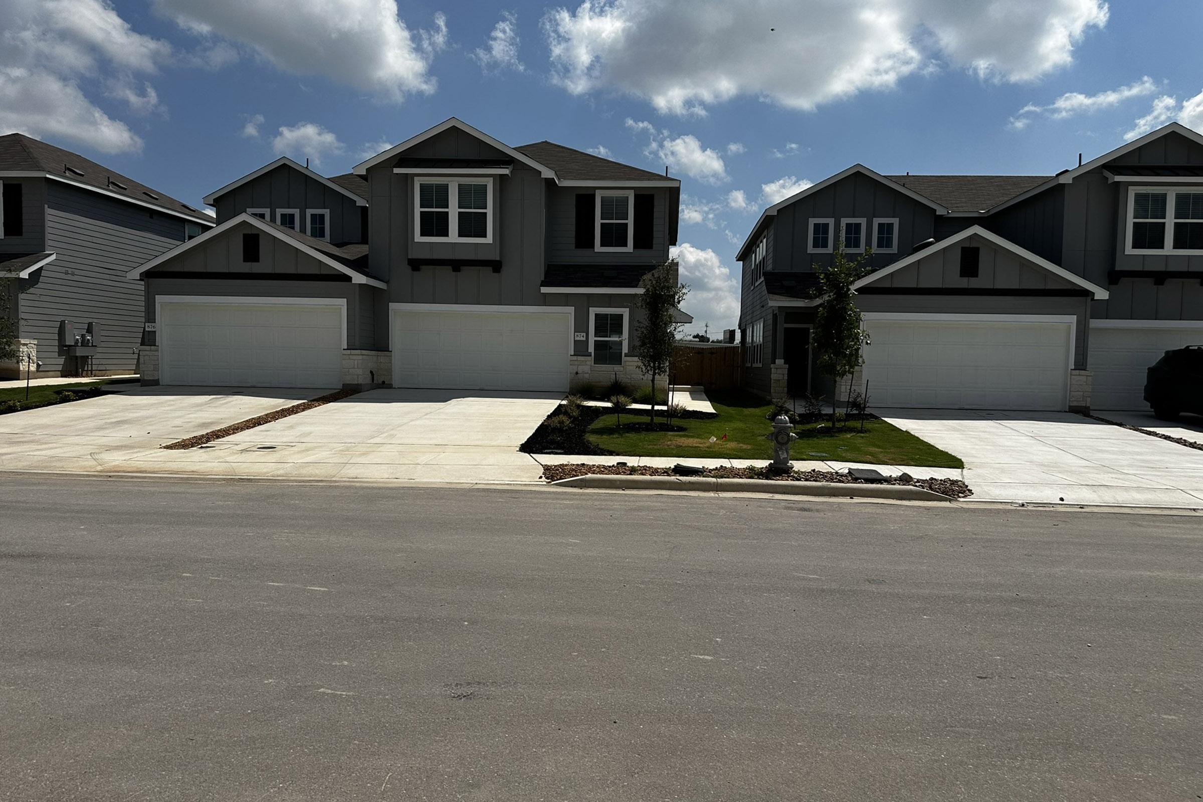 a house on the side of a road