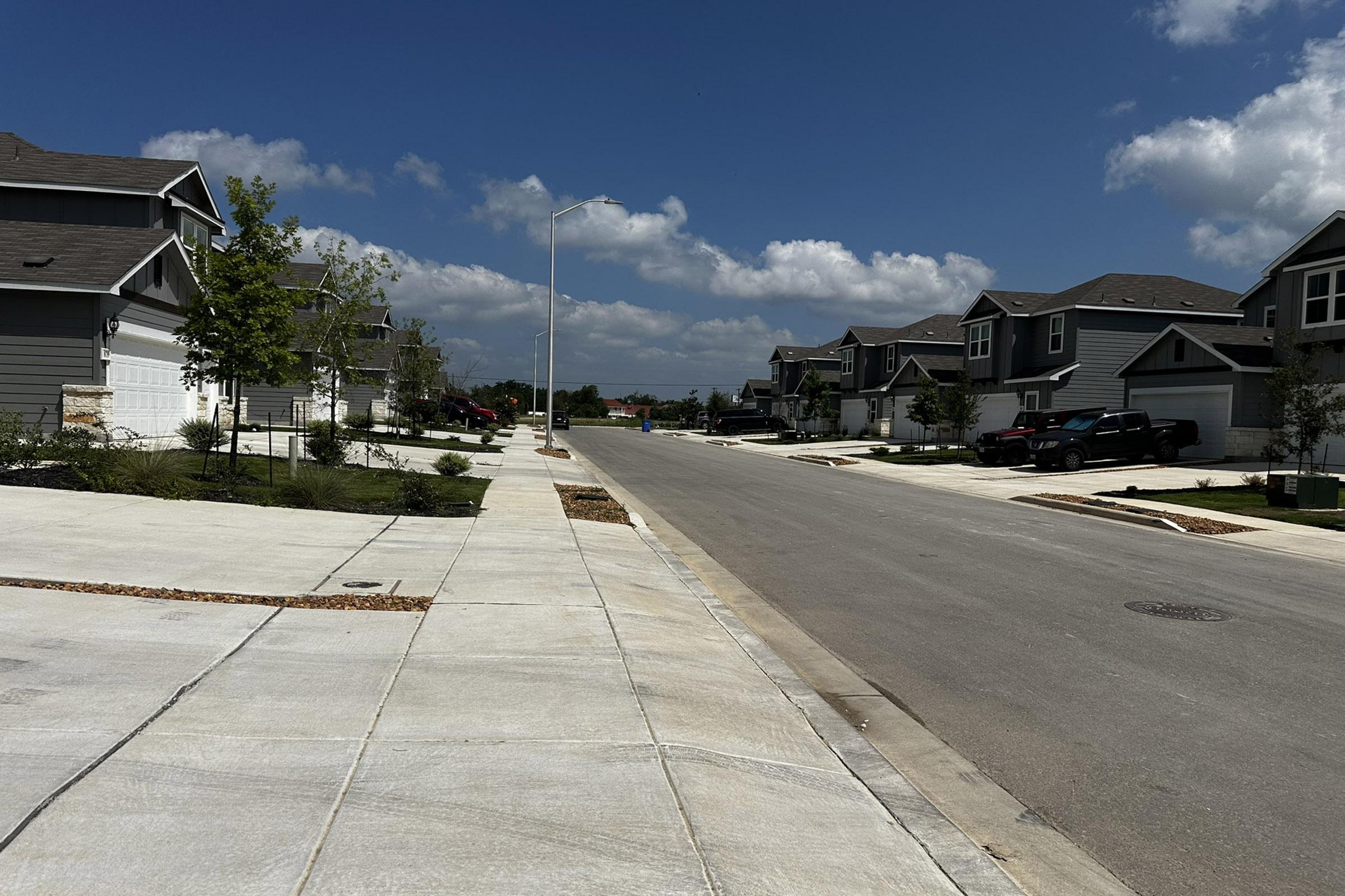 a street scene with focus on the side of a road