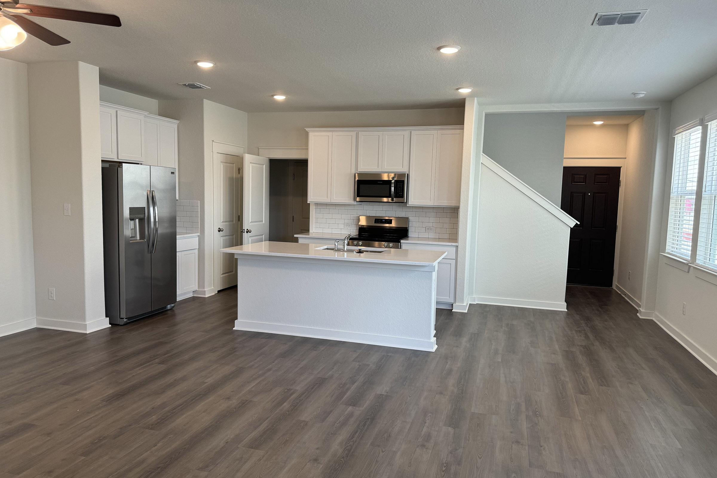 a kitchen with a wood floor