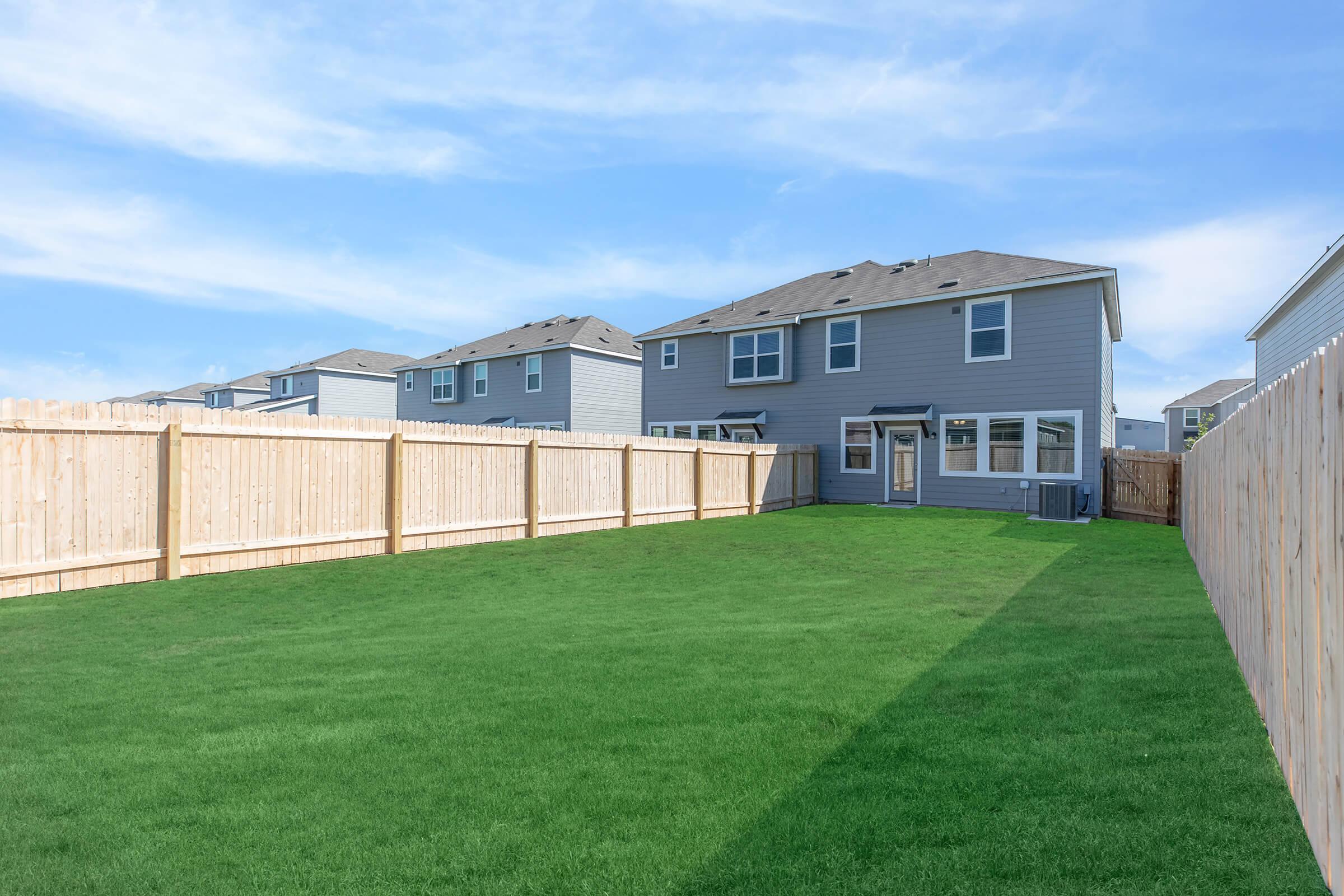 a large lawn in front of a house