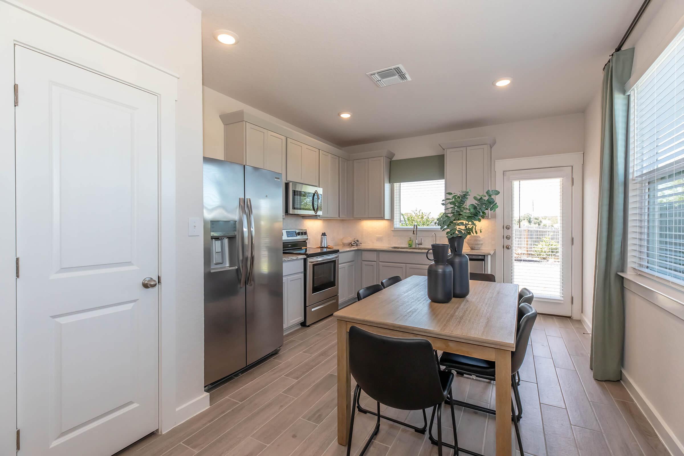 a kitchen with a large window