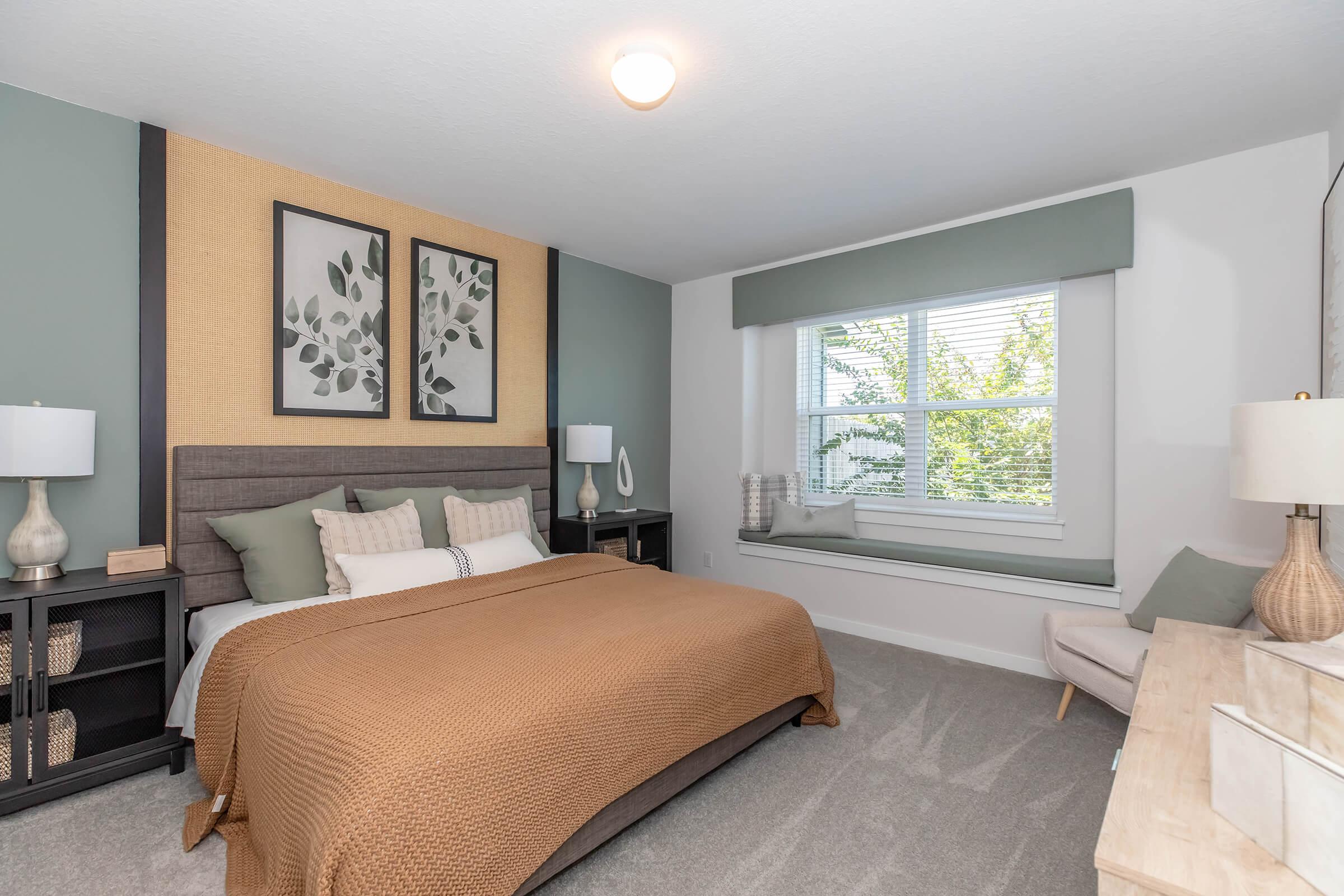 a bedroom with a large bed in a hotel room