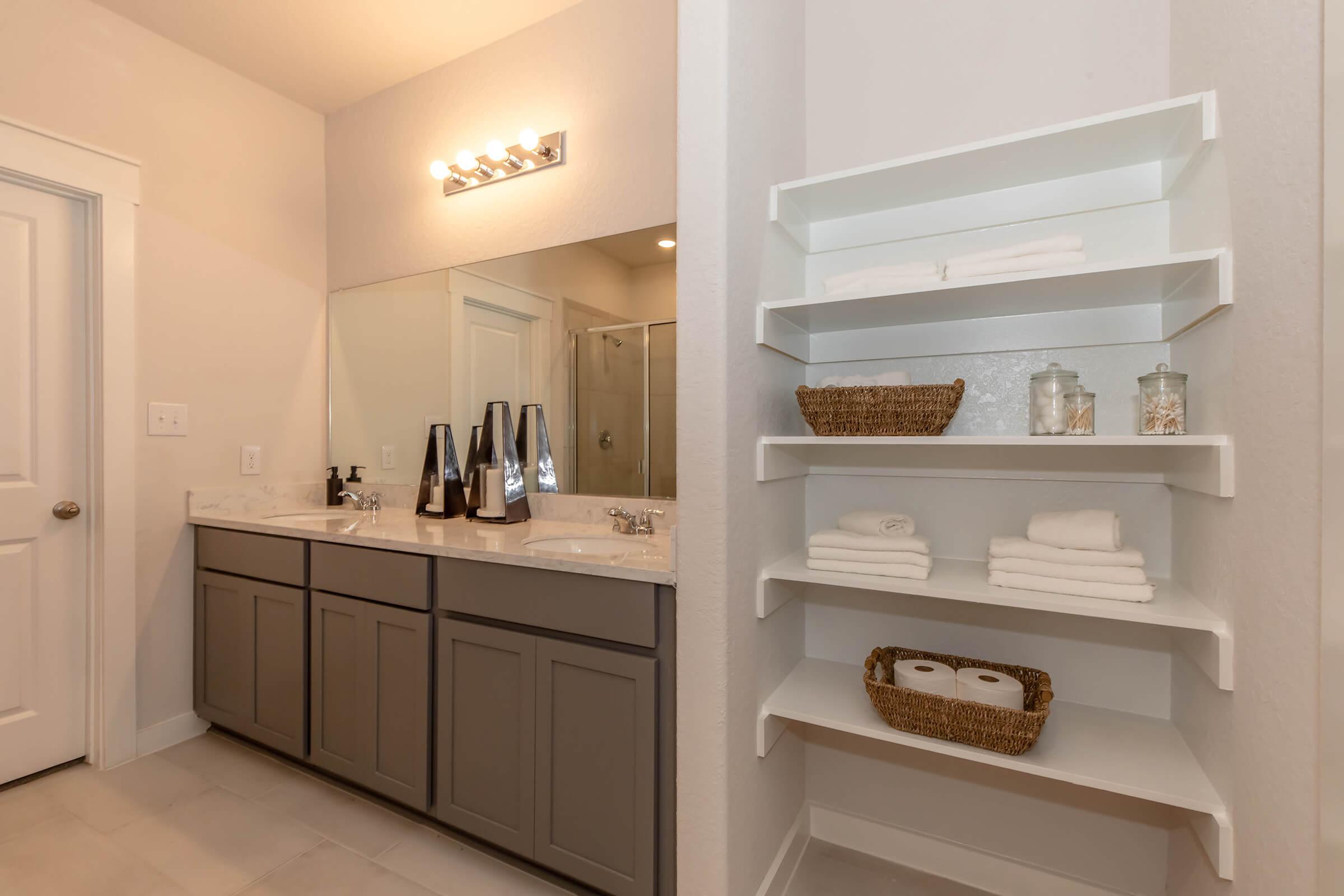 a kitchen with a sink and a mirror