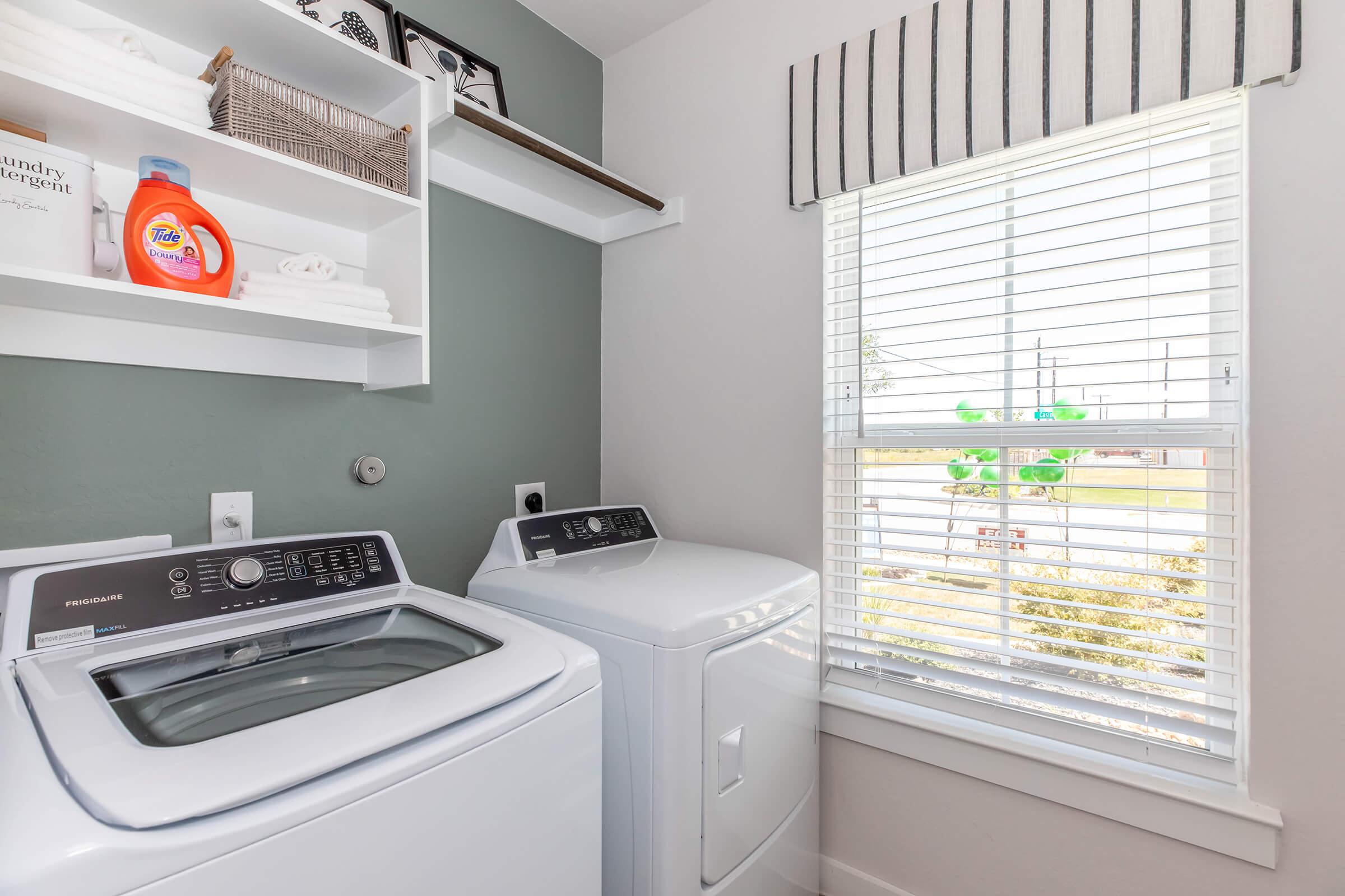 a microwave oven sitting on top of a refrigerator