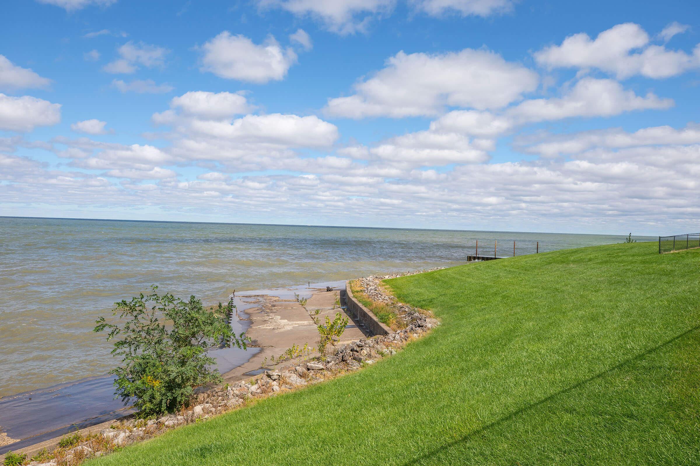 a bench next to a body of water