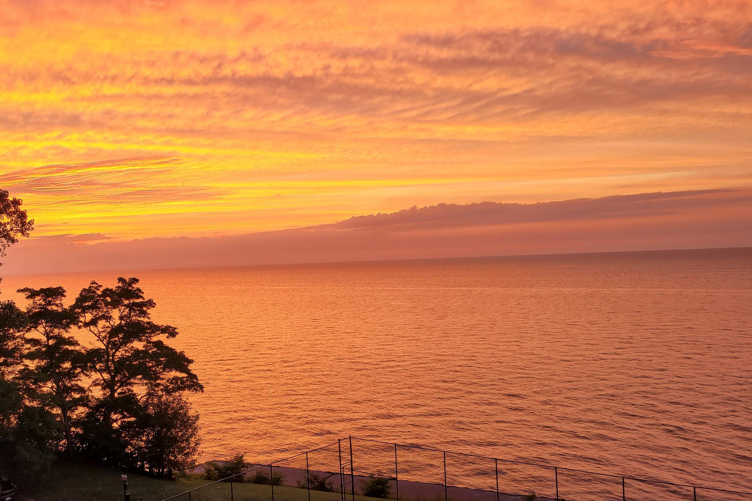 a sunset over a body of water