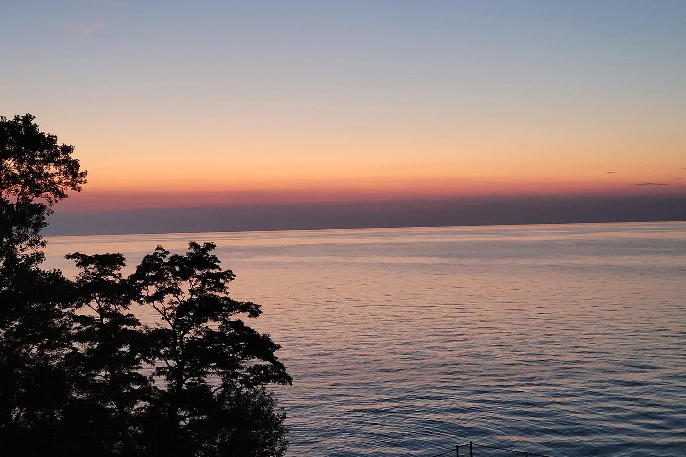 a sunset over a body of water