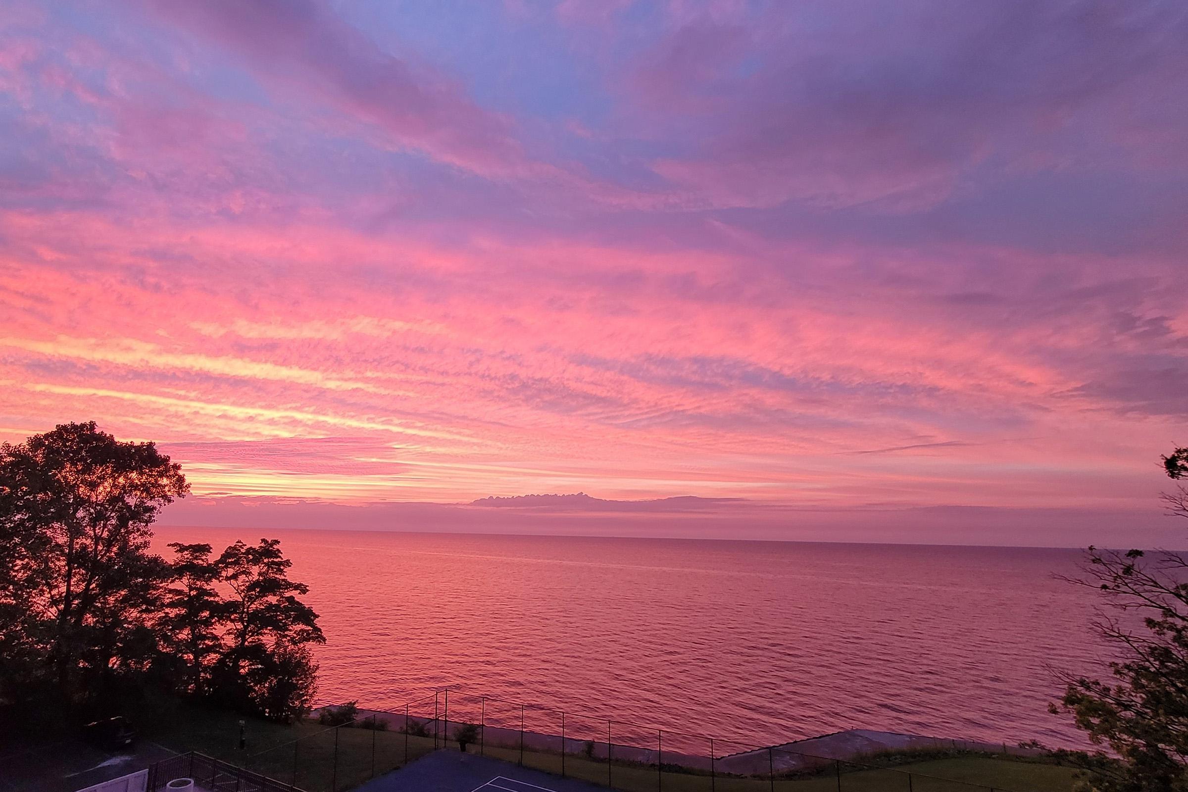 a sunset over a body of water