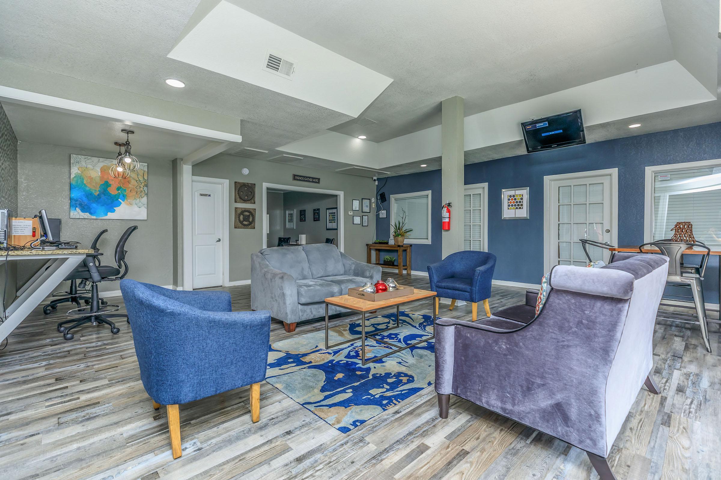 a living room filled with furniture and a rug