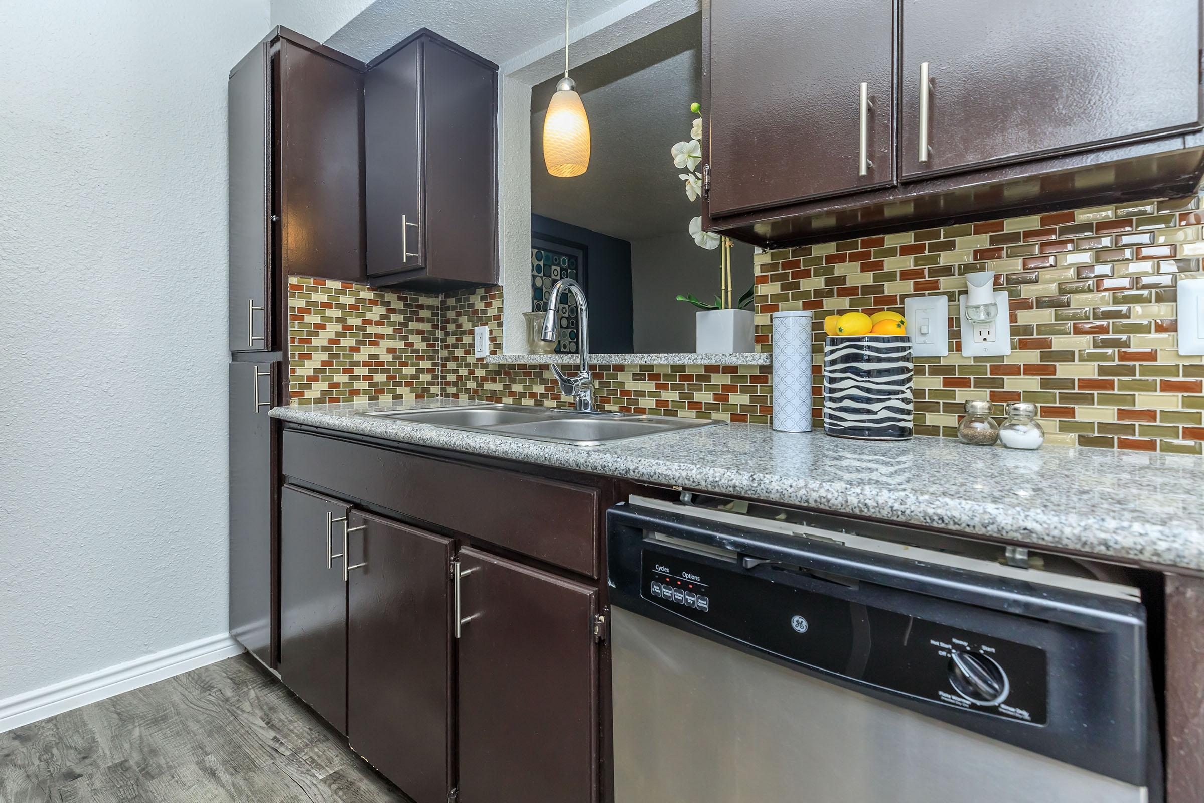 a large kitchen with stainless steel appliances