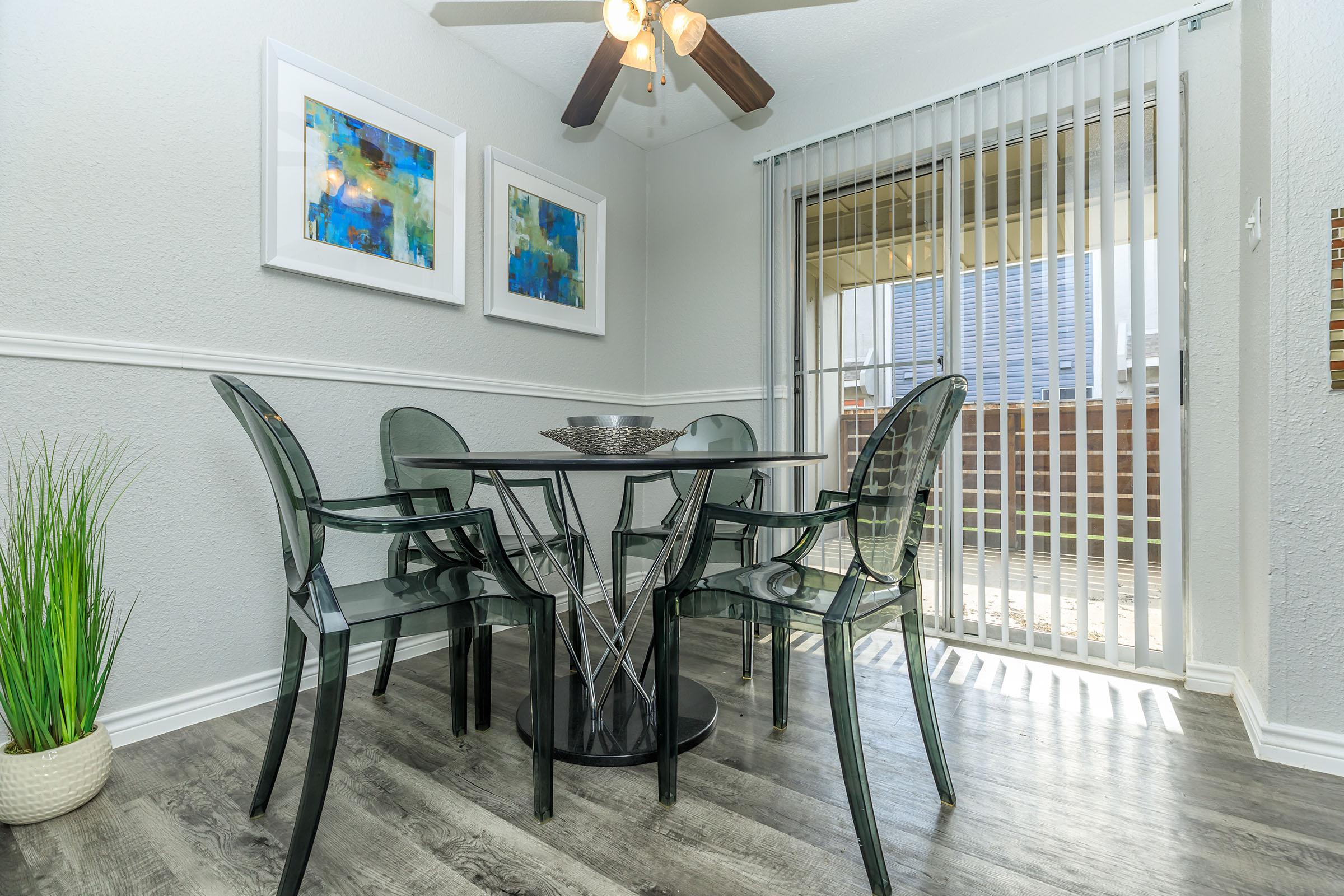 a room filled with furniture and a large window