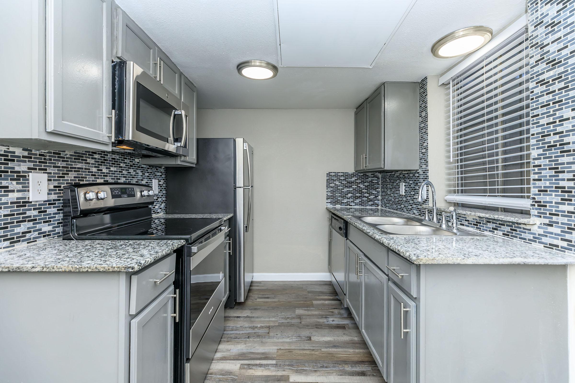 a kitchen with a stove top oven