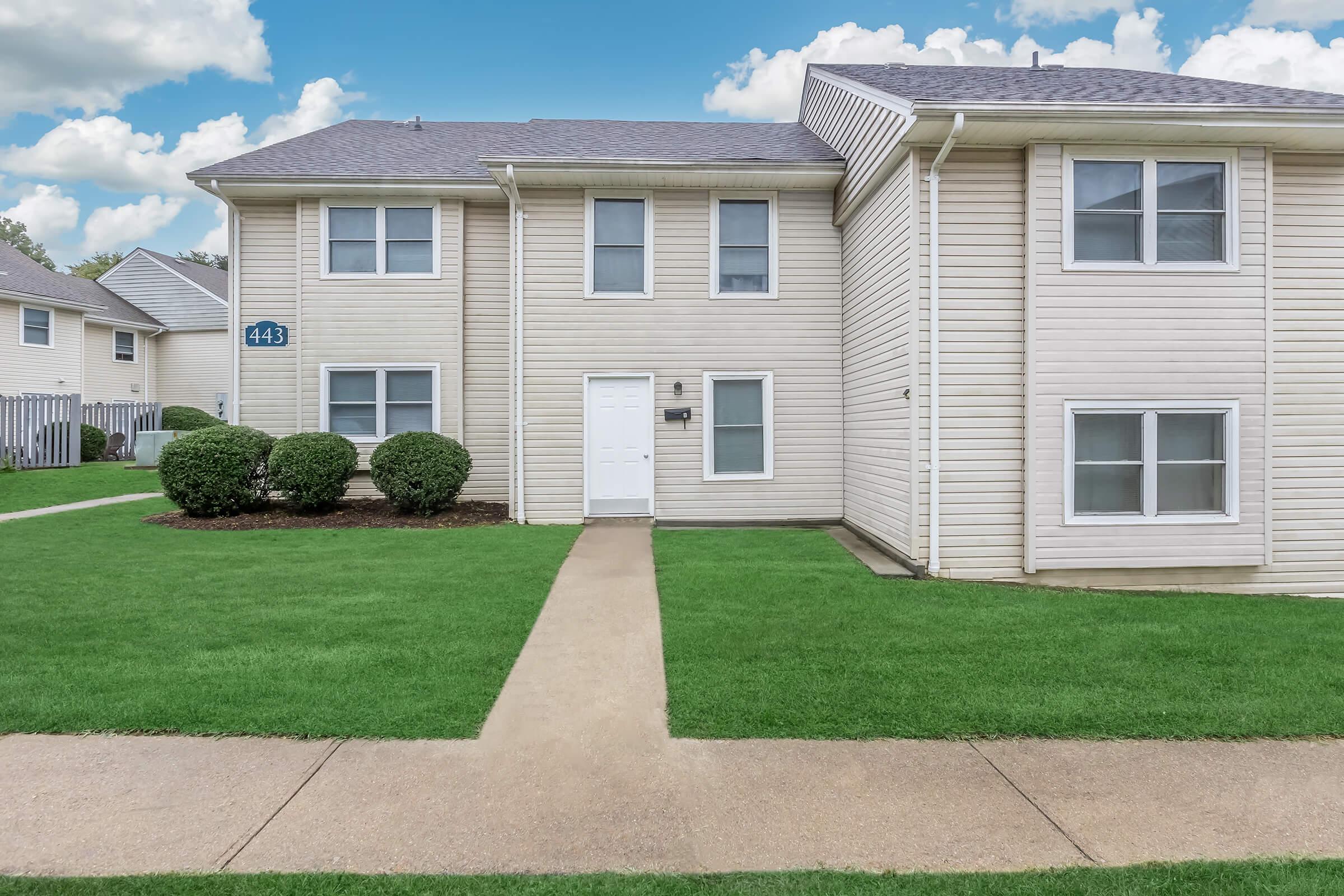 a large lawn in front of a house