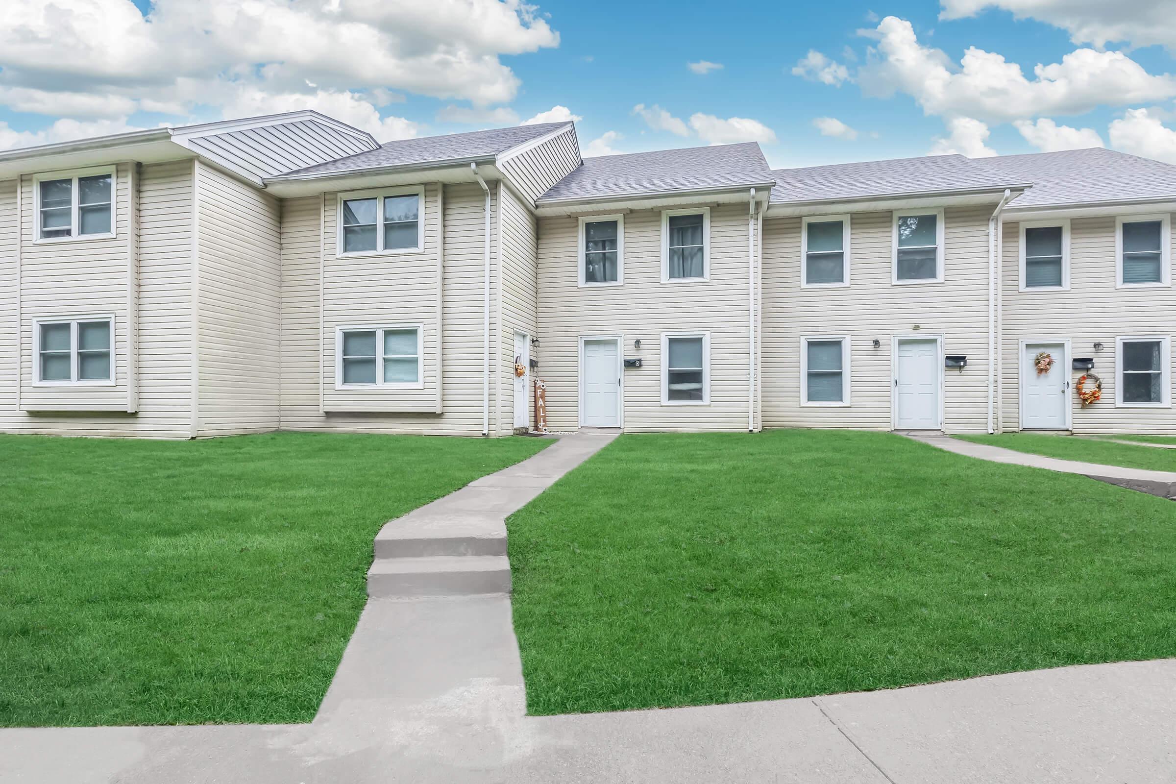 a large lawn in front of a house